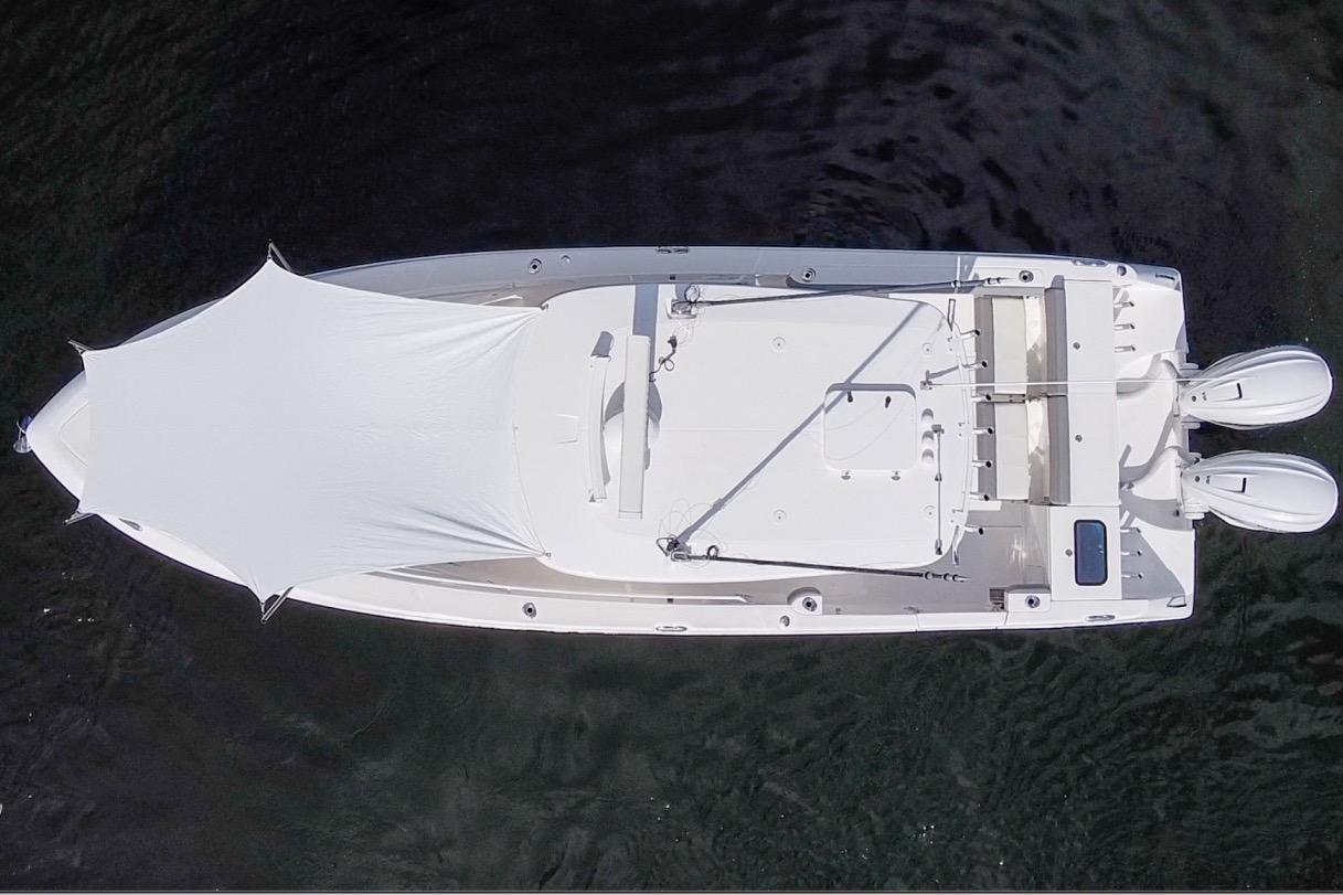 Overhead view of 2021 Everglades 335 Center Console boat with canopy on water.