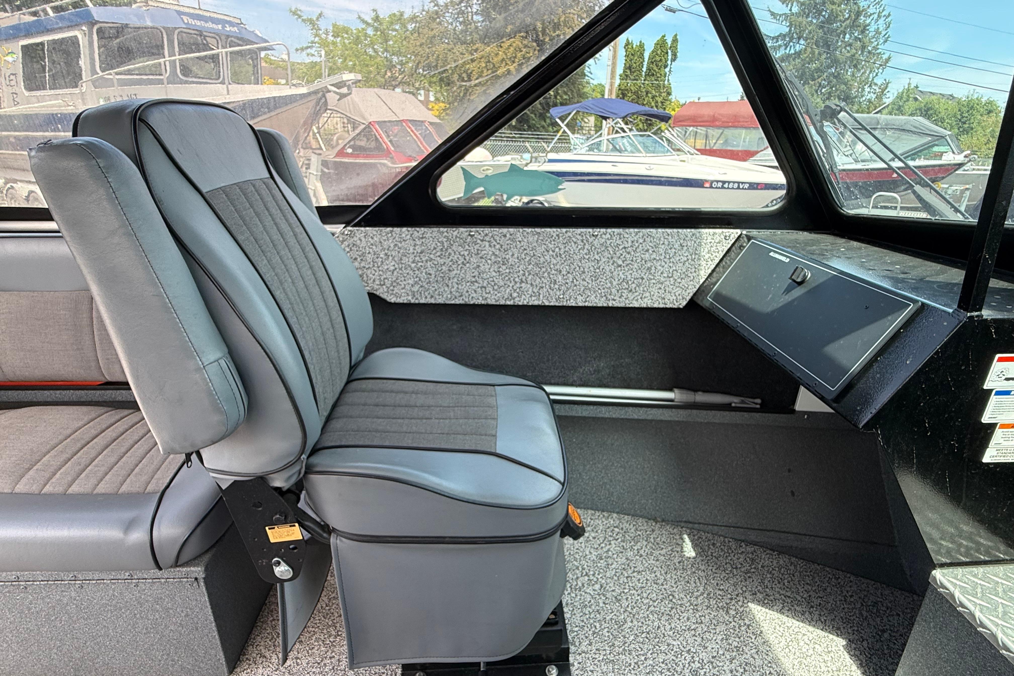 Interior of a 2019 Alumaweld Intruder Hard Top 22' boat with gray seating.