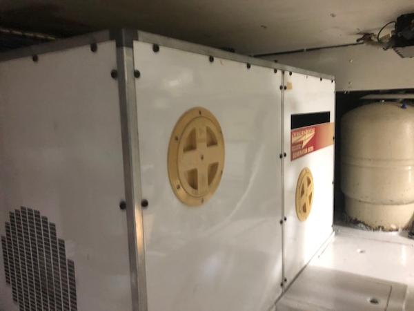 1997 Bertram Convertible engine compartment with generator and equipment.