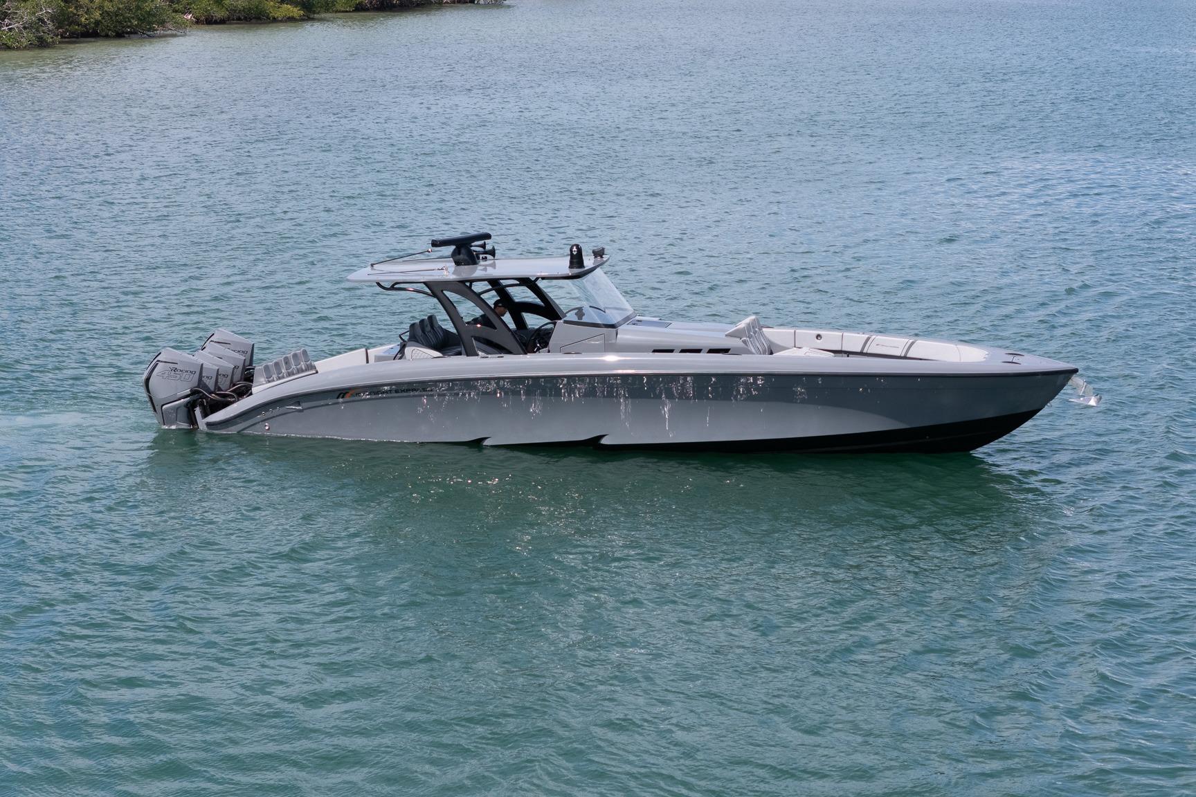 2023 Midnight Express 43 Solstice boat on calm water, showcasing sleek design and powerful engines.