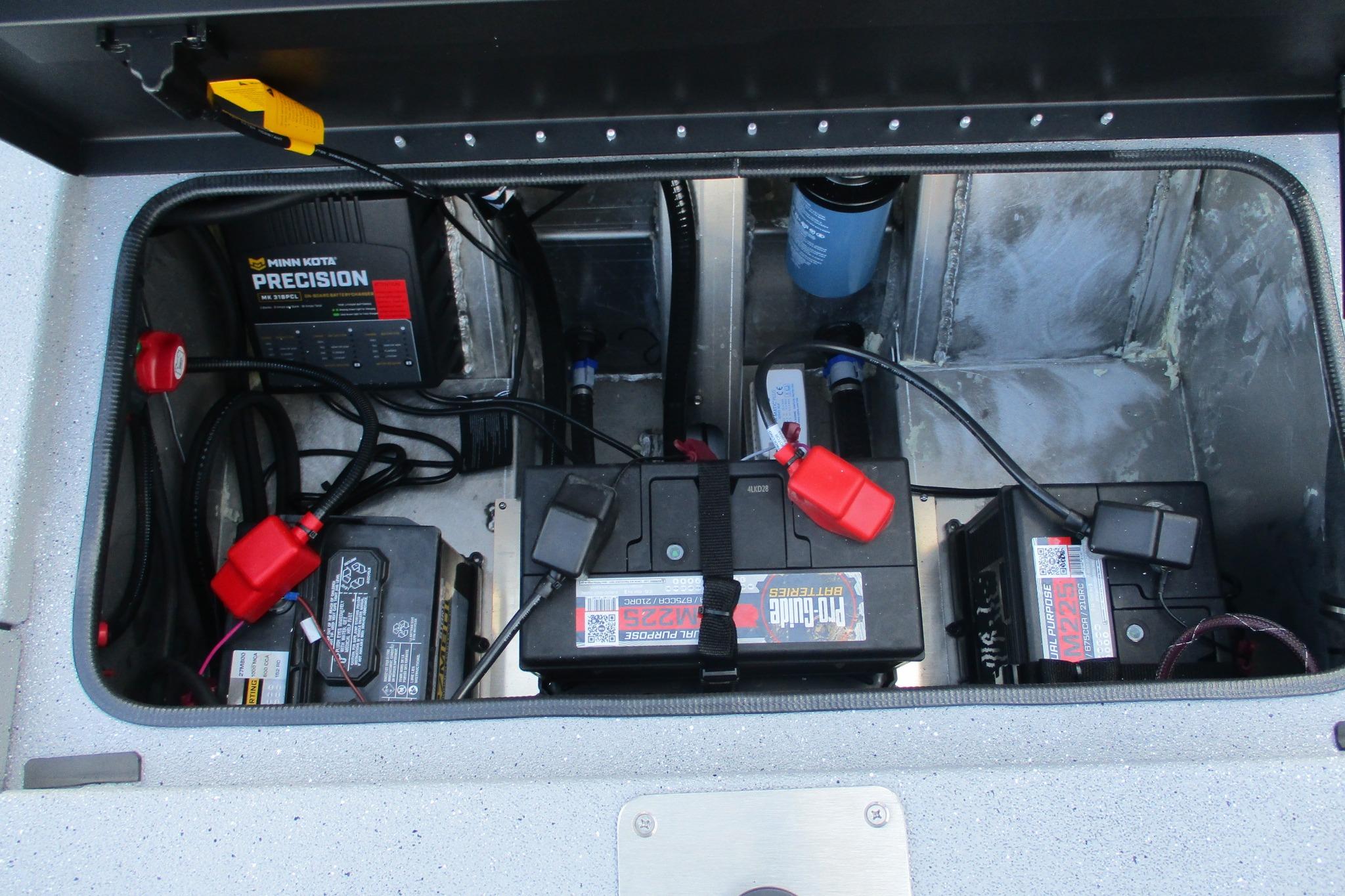 Battery compartment of 2026 Vexus AVX2080 boat with Minn Kota Precision charger.