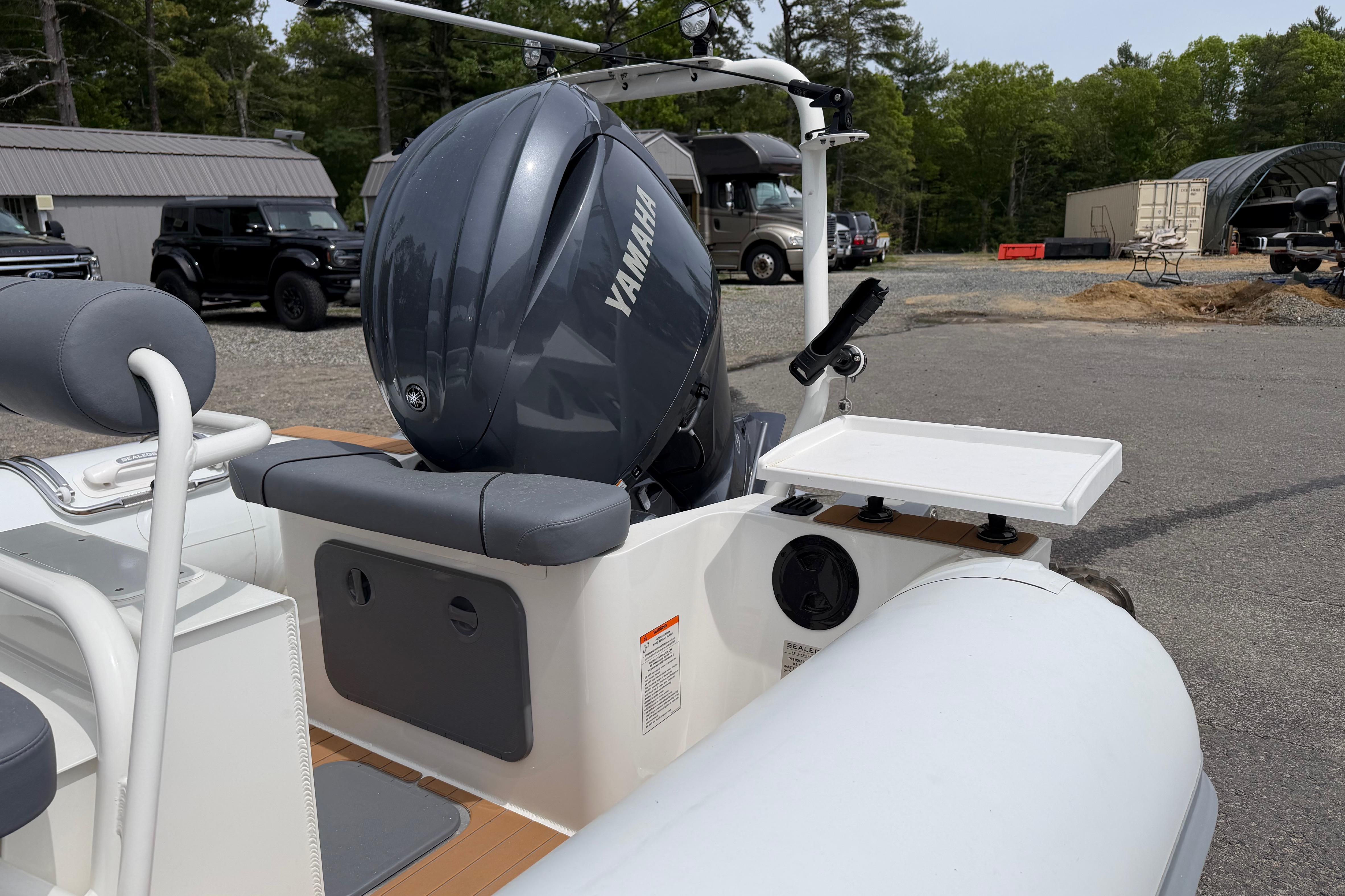 2024 Sealegs 7.1m RIB with Yamaha engine, parked outdoors.