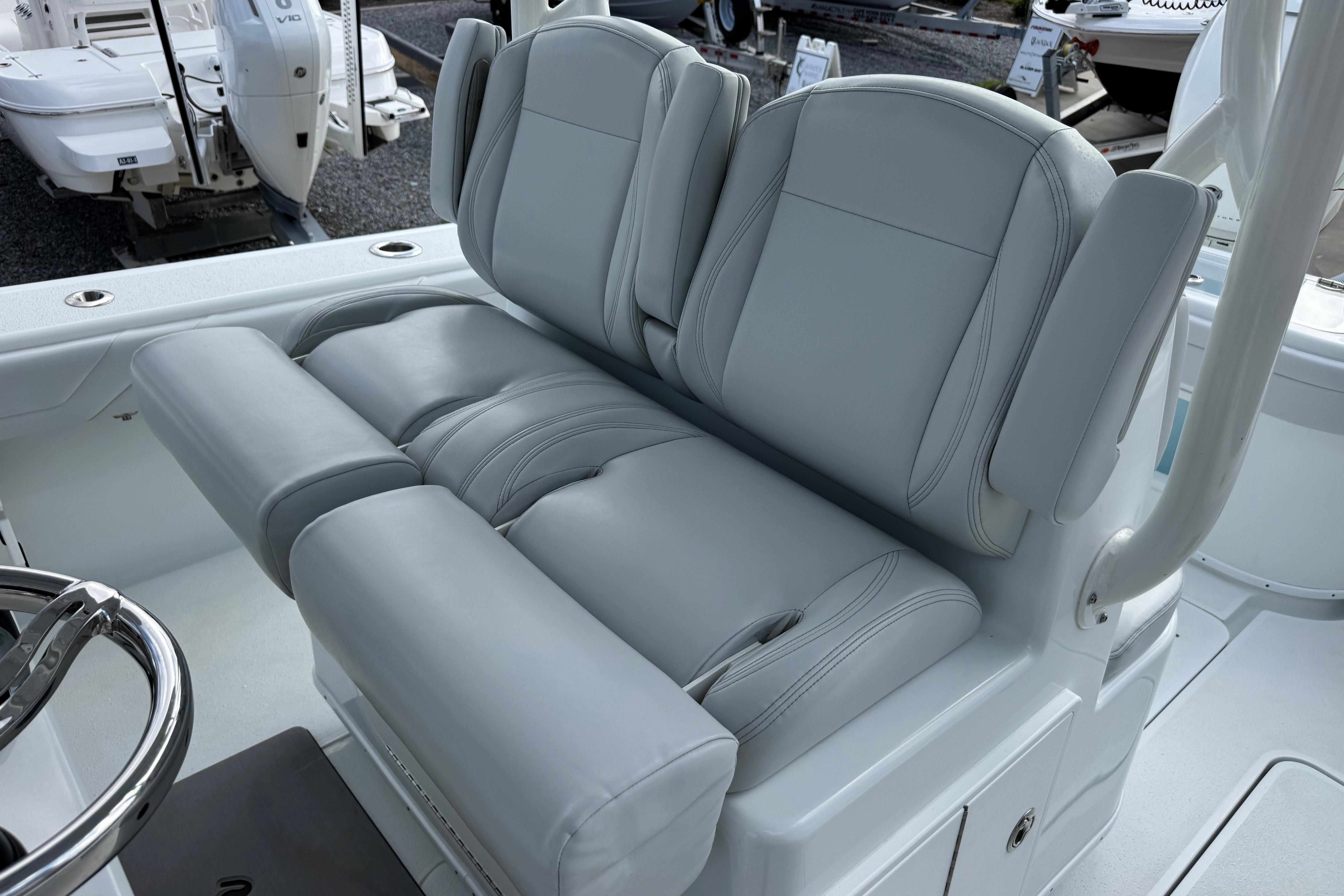 2022 Yellowfin 32 Offshore boat with luxurious gray seating and steering wheel detail.