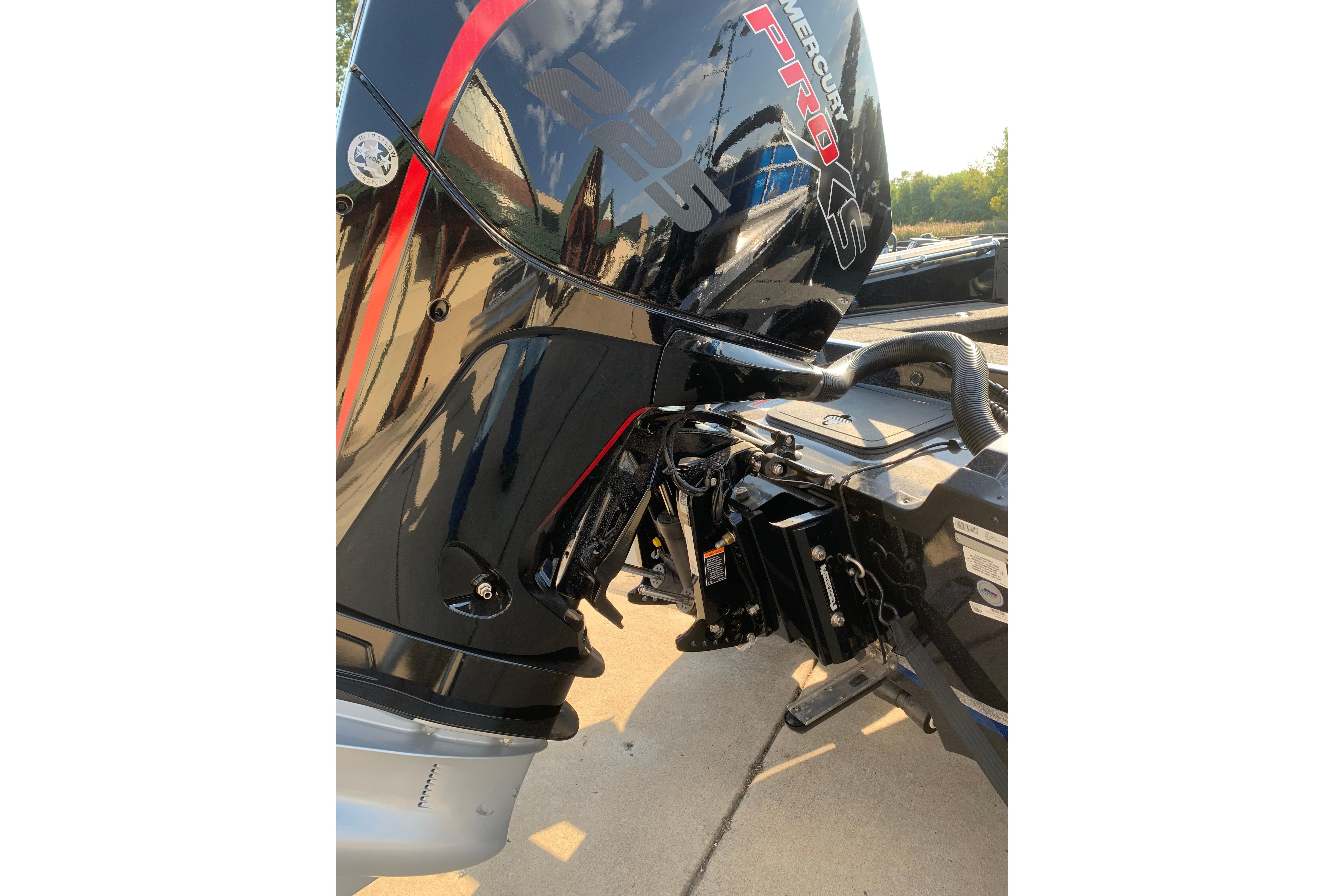 2025 Nitro ZV20 boat with Mercury Pro XS engine, showcasing sleek black and red design.