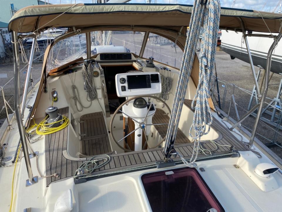 2006 Southerly 135 sailboat cockpit with navigation equipment and canopy.
