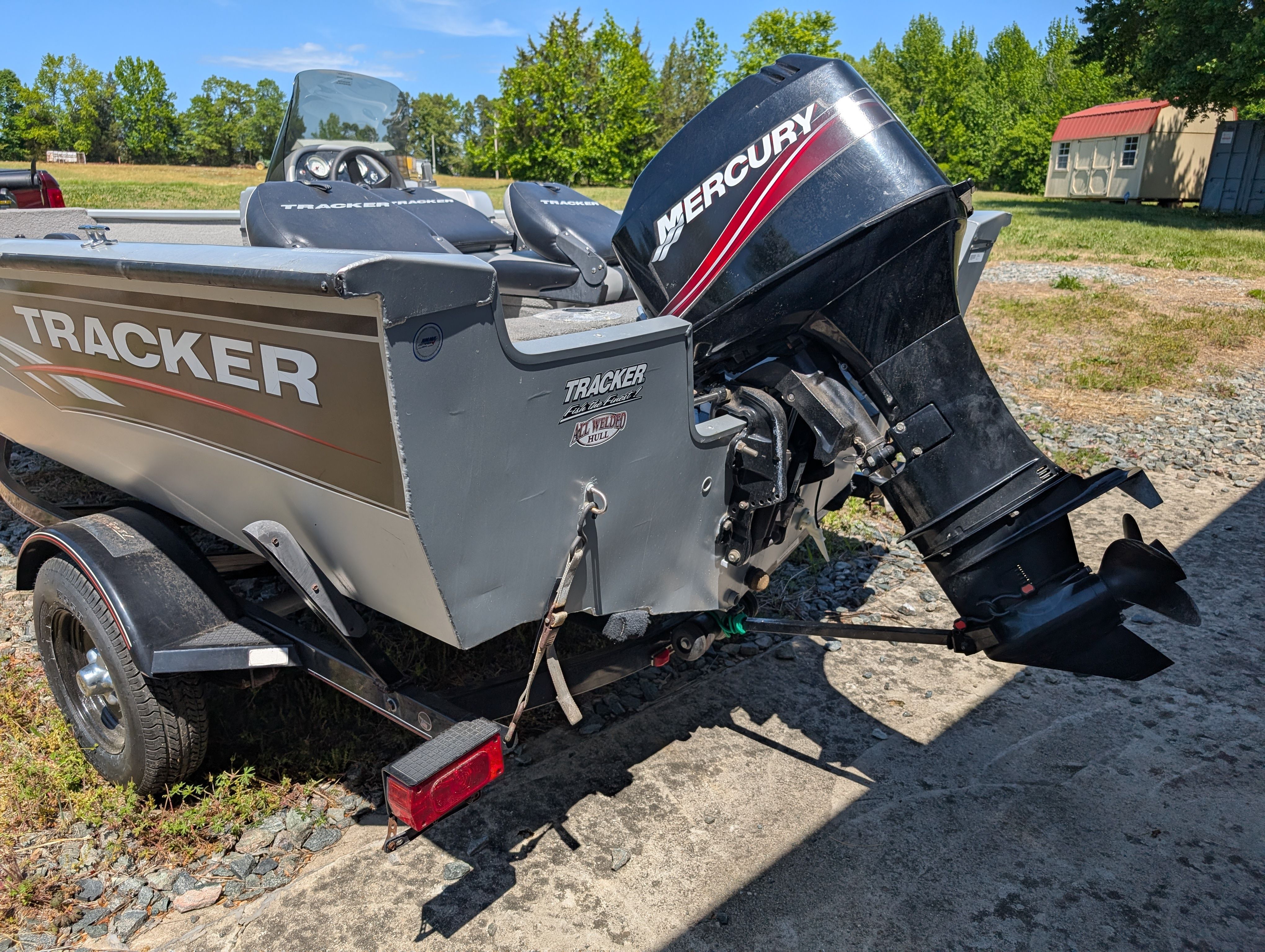 2009 Tracker Pro Guide V16 SE boat with Mercury outboard motor.