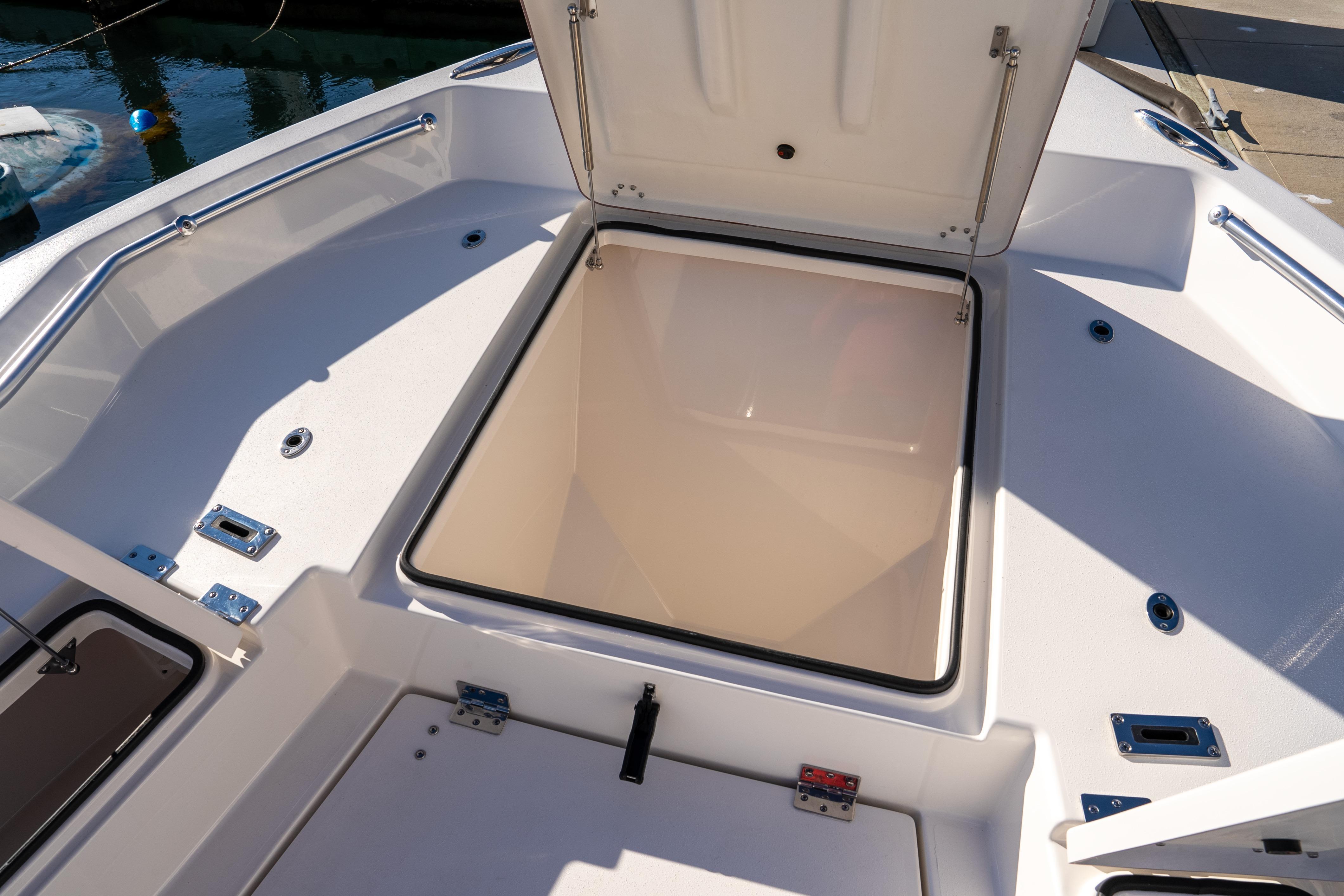 Open storage compartment on 2026 Bay Rider 269 Bay boat deck.