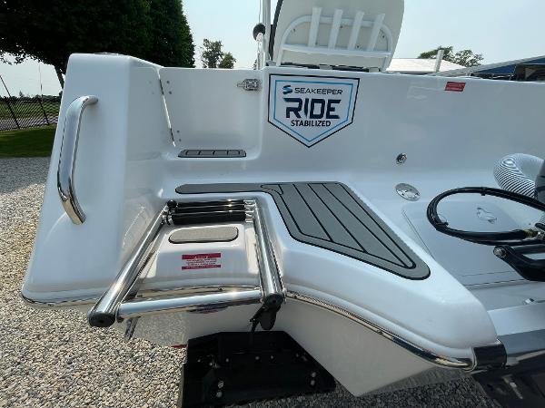 2025 Tidewater 232 CC Adventure boat with Seakeeper Ride Stabilized system and swim ladder.