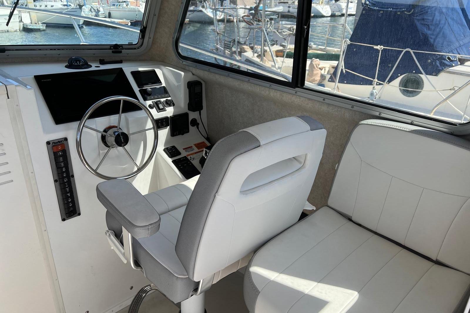 2023 Parker 2820 XLD Sport Cabin interior with steering wheel and seating.