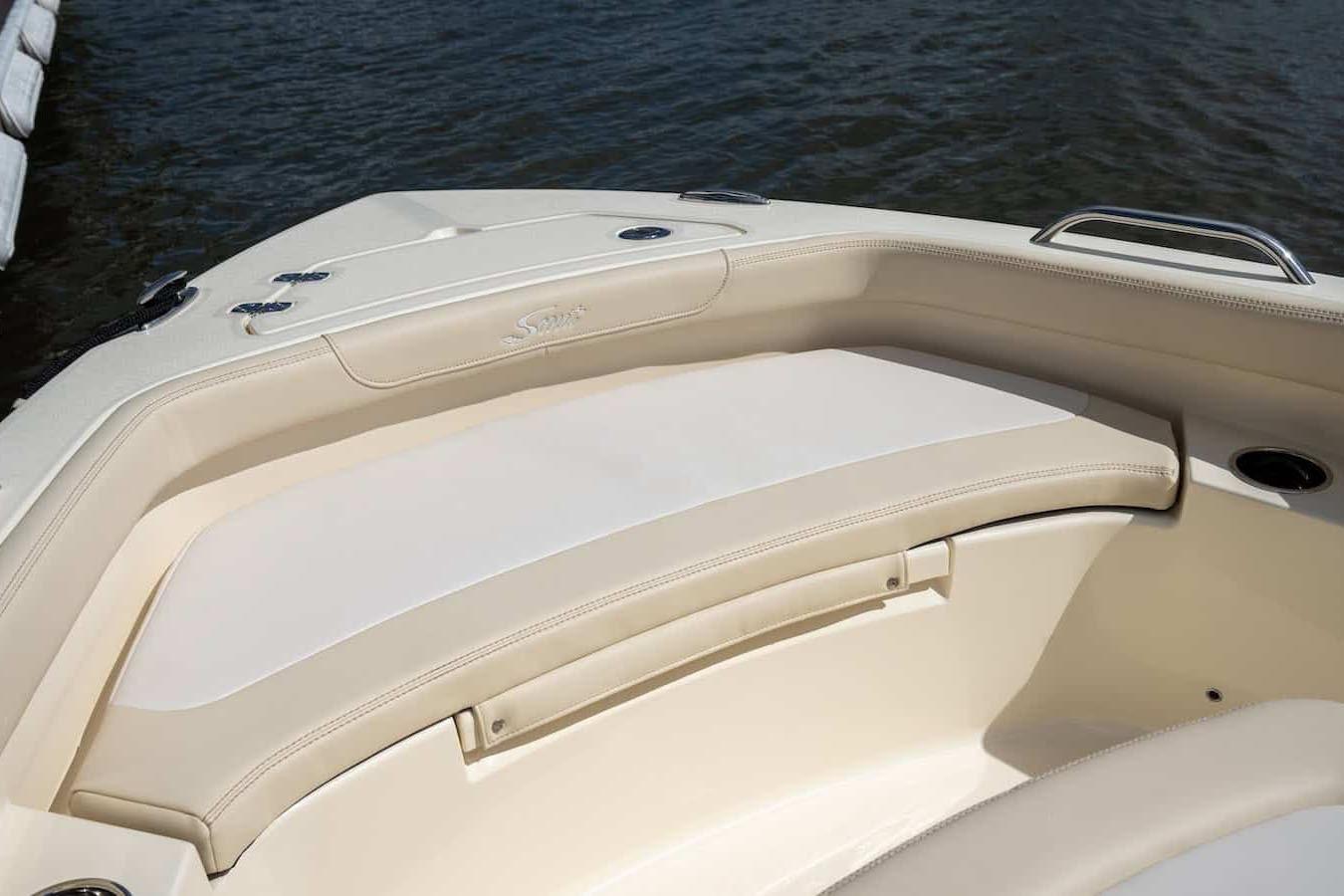 Manufacturer Provided Image: 2026 Scout 188 Sportfish boat interior with beige seating, near water.