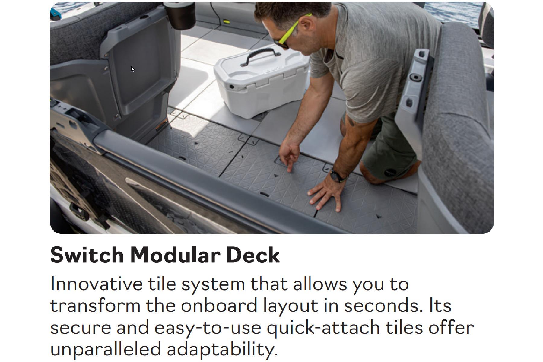 Man adjusting modular deck tiles on 2026 Sea-Doo Switch Cruise 21 boat for adaptable layout.