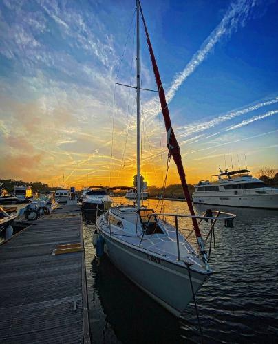 1988 O'Day 272 LE sailboat docked at sunset.
