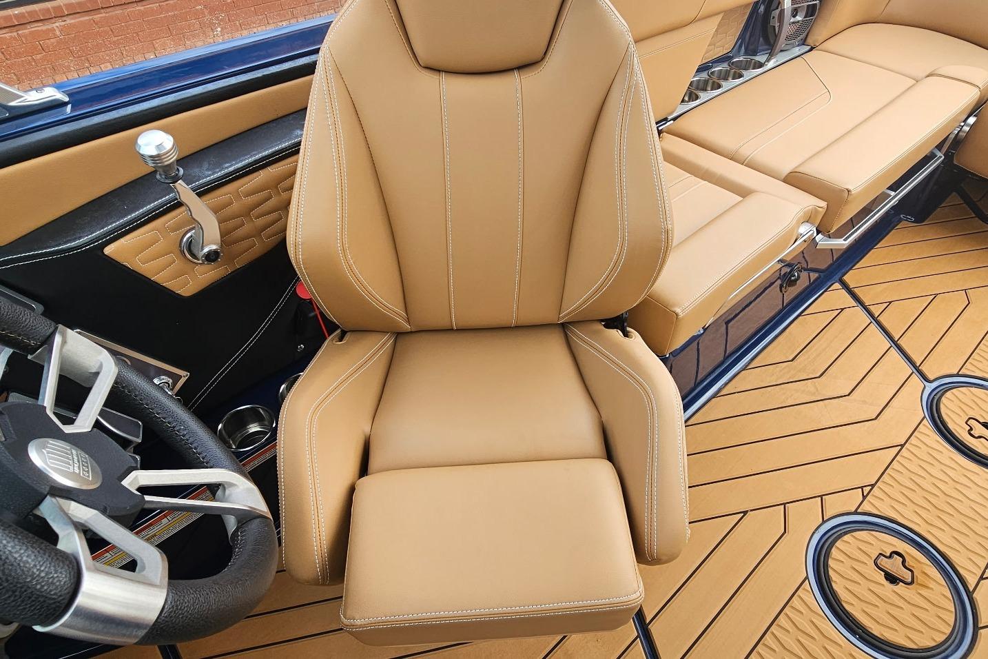 2020 MasterCraft X24 interior with tan leather seats and modern steering wheel design.