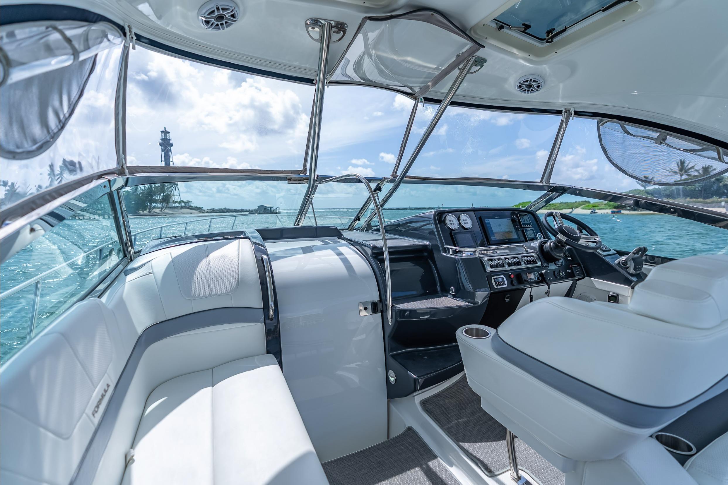 2022 Formula 40 Performance Cruiser interior with ocean view and lighthouse in background.