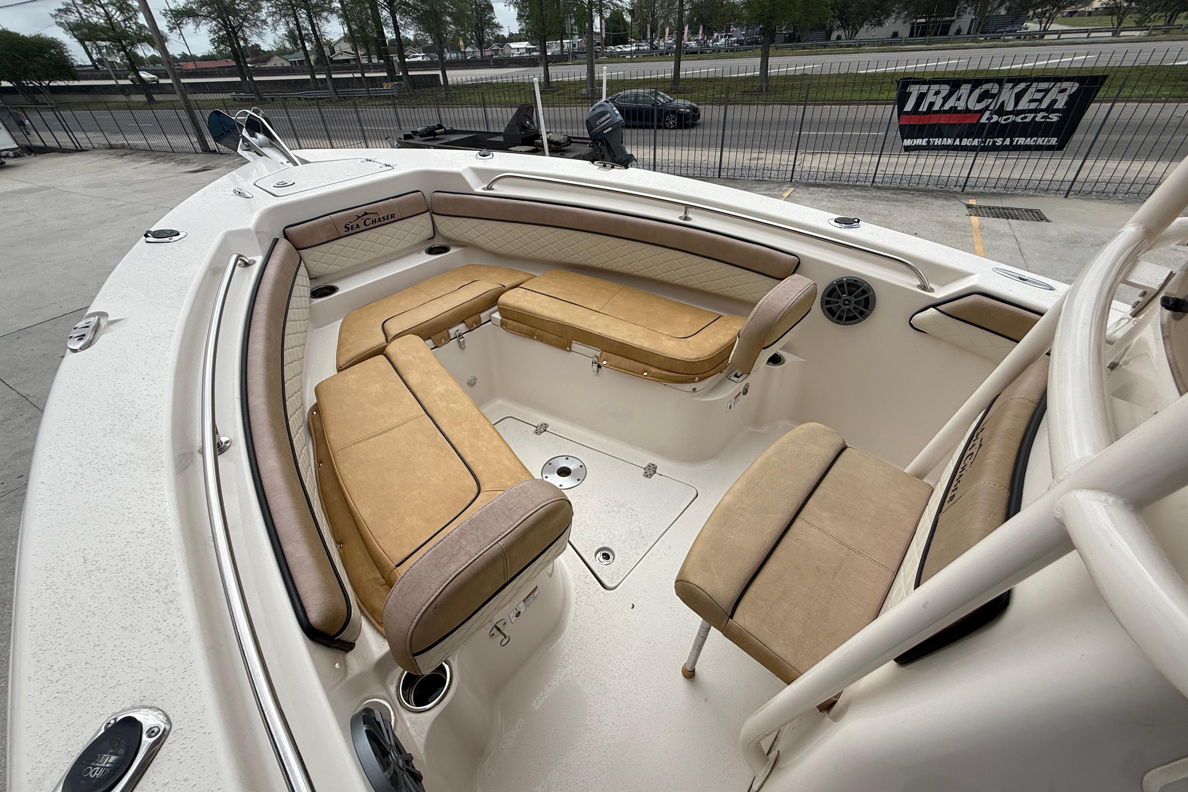 2023 SeaChaser 24 HFC boat interior with tan seating and spacious layout.