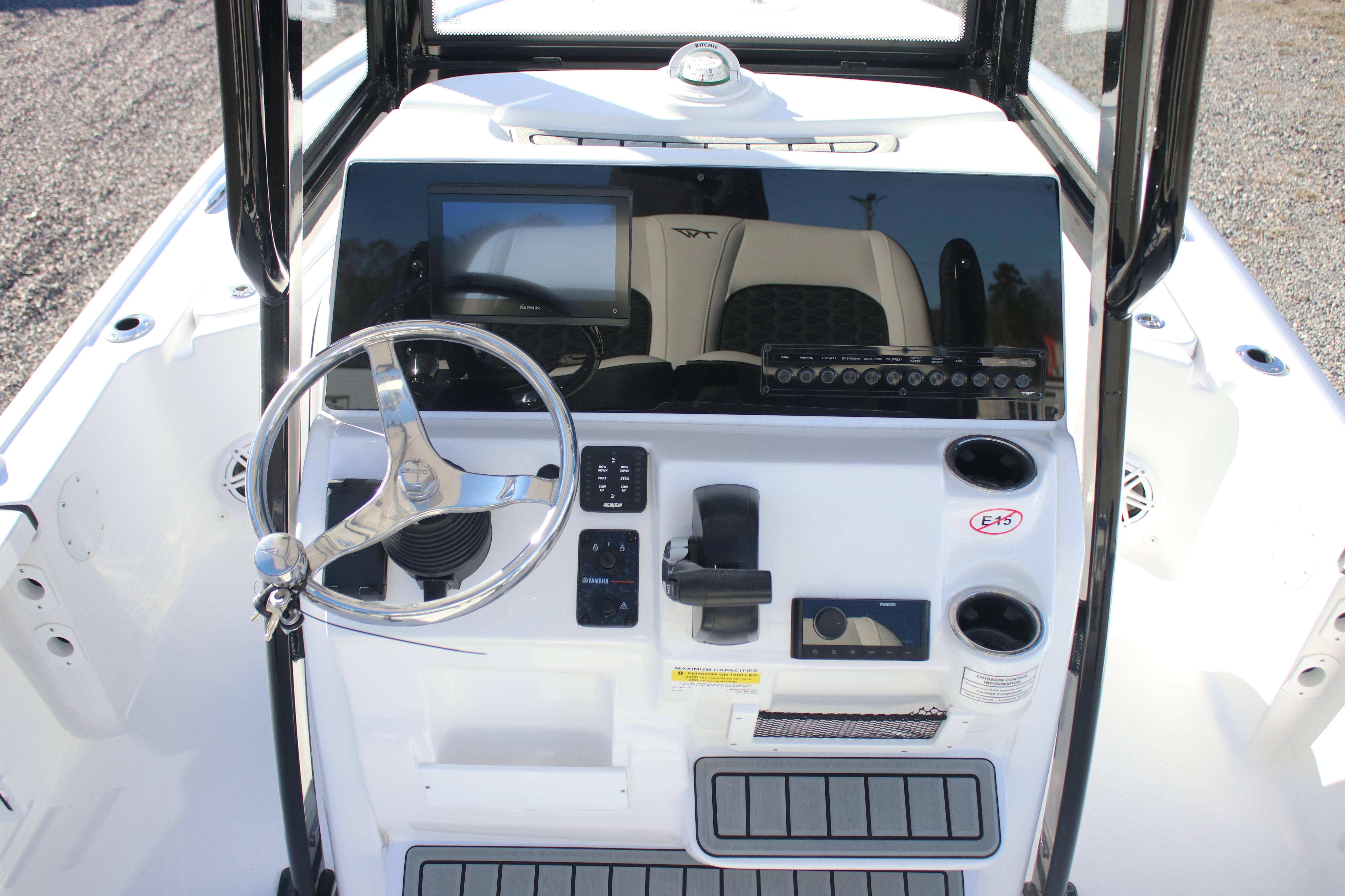 2026 Tidewater 2210 Carolina Bay boat console with steering wheel and controls.