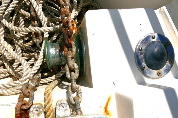 Rope and chain on 1989 Catalina 34 boat deck, showing wear and rust.