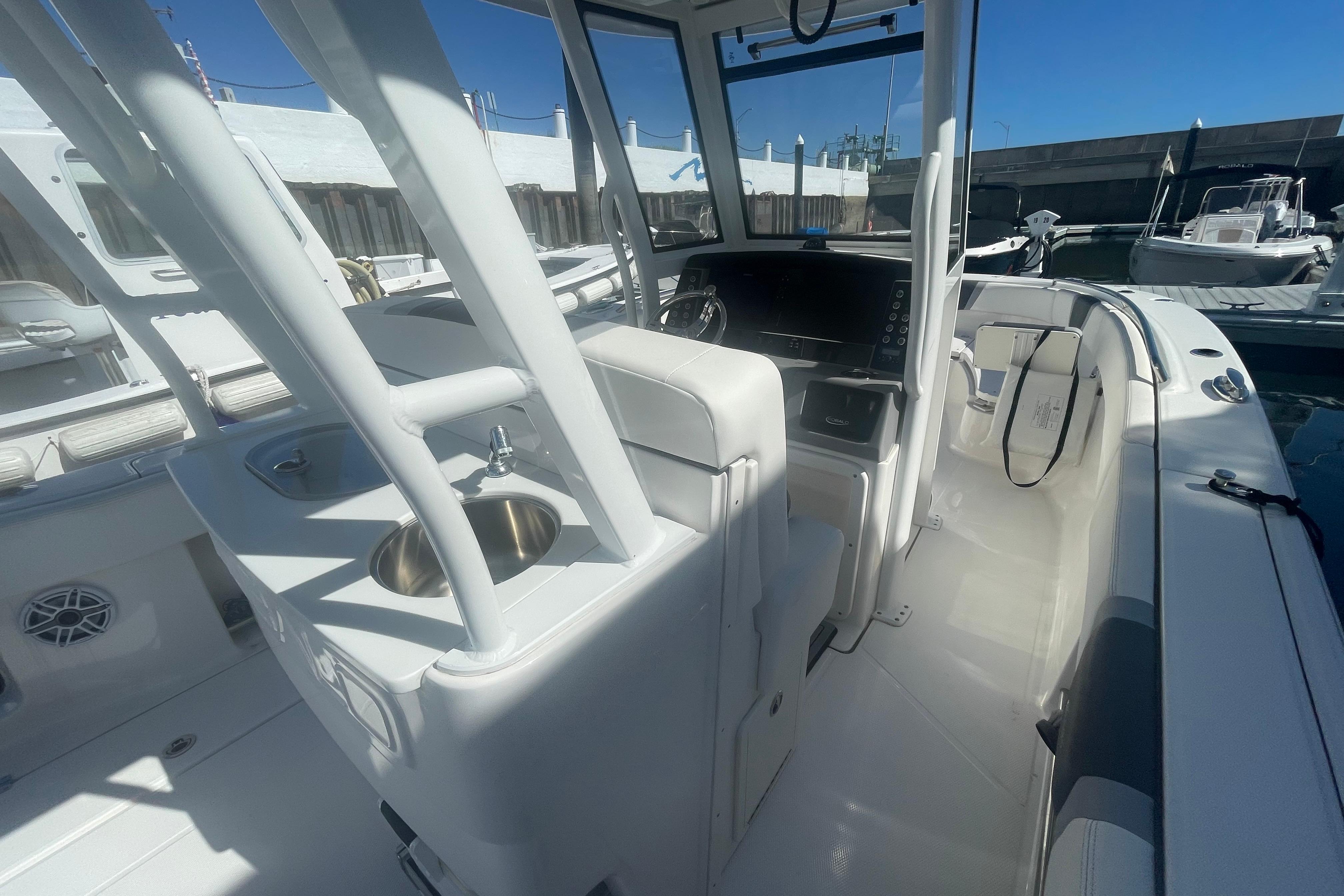 2023 Robalo R270 Center Console boat interior with helm and seating area.