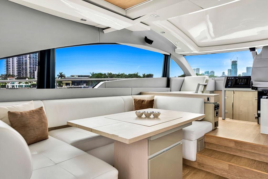 Luxurious interior of 2012 Fairline Targa 58 yacht with modern seating and scenic views.