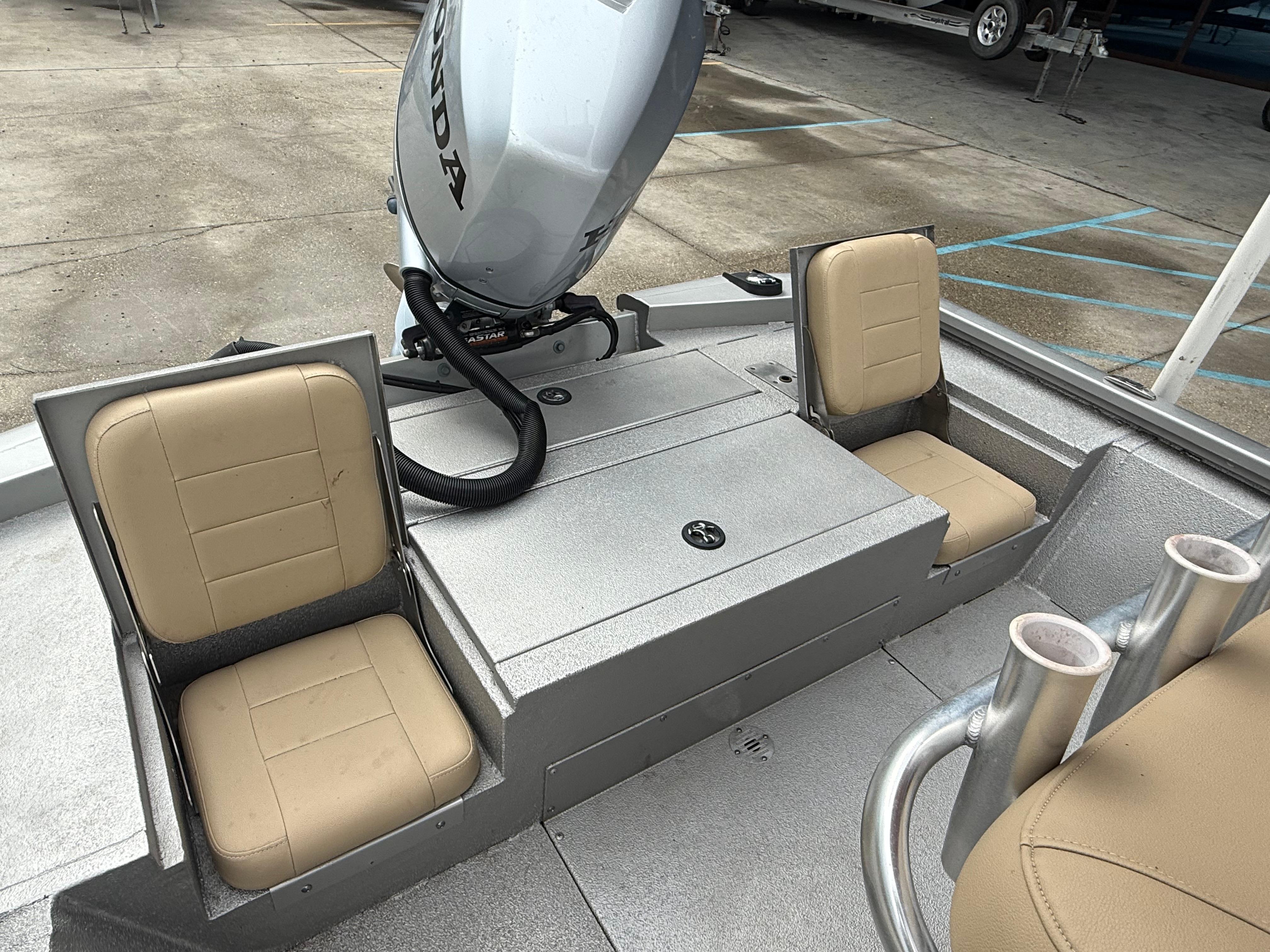2020 Avid 23 FS Platinum boat interior with beige seats and Honda motor.