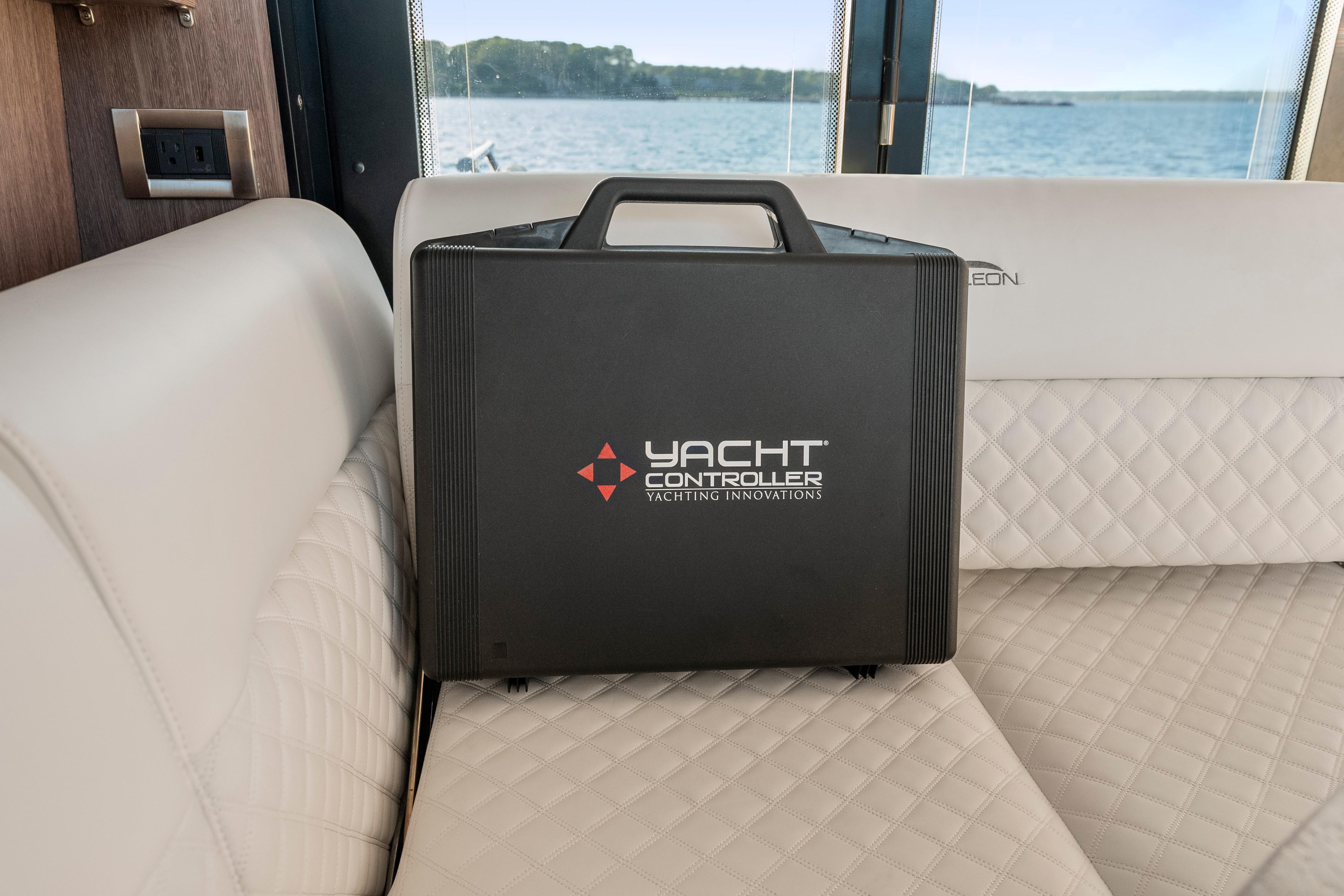 Black Yacht Controller case on Galeon 400 Fly's luxurious interior seating, 2023 model.