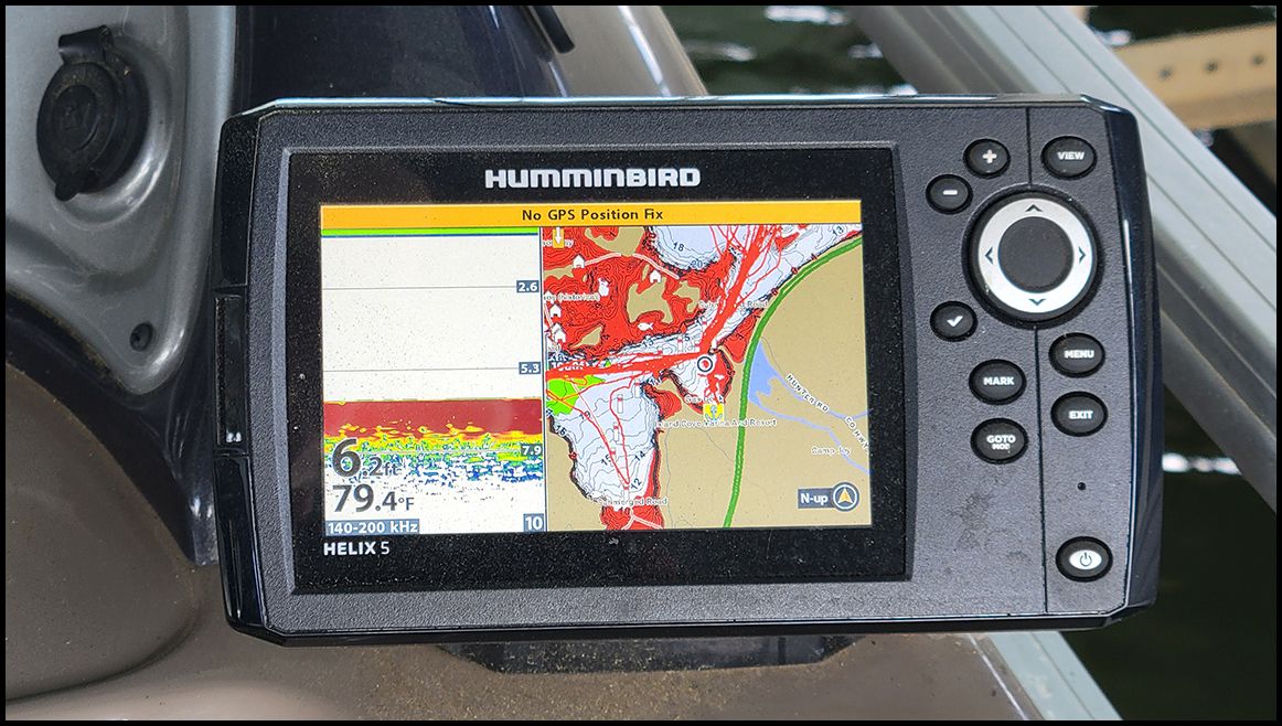 A Humminbird Helix 5 fish finder displays a map with depth information.