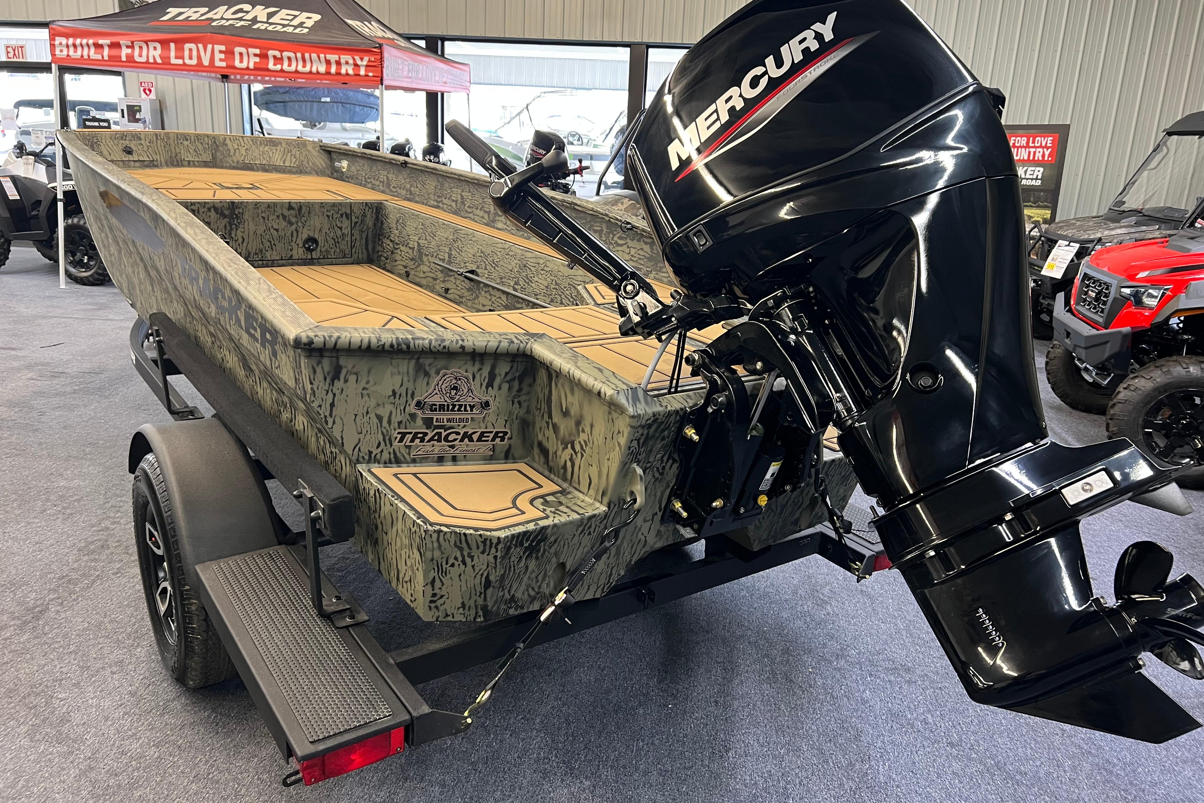 2026 Tracker Grizzly 1650 T Prairie Wings Edition boat with Mercury outboard motor.