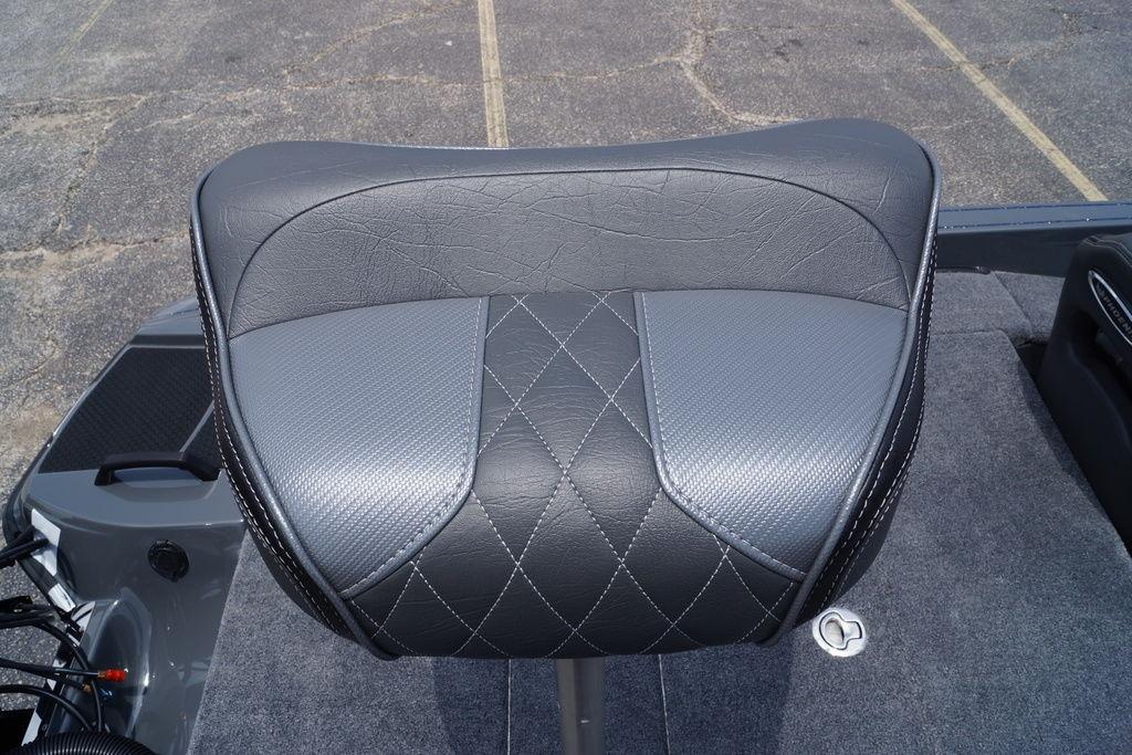 Gray leather seat of 2027 Phoenix 921 Elite X II boat, featuring diamond stitching.