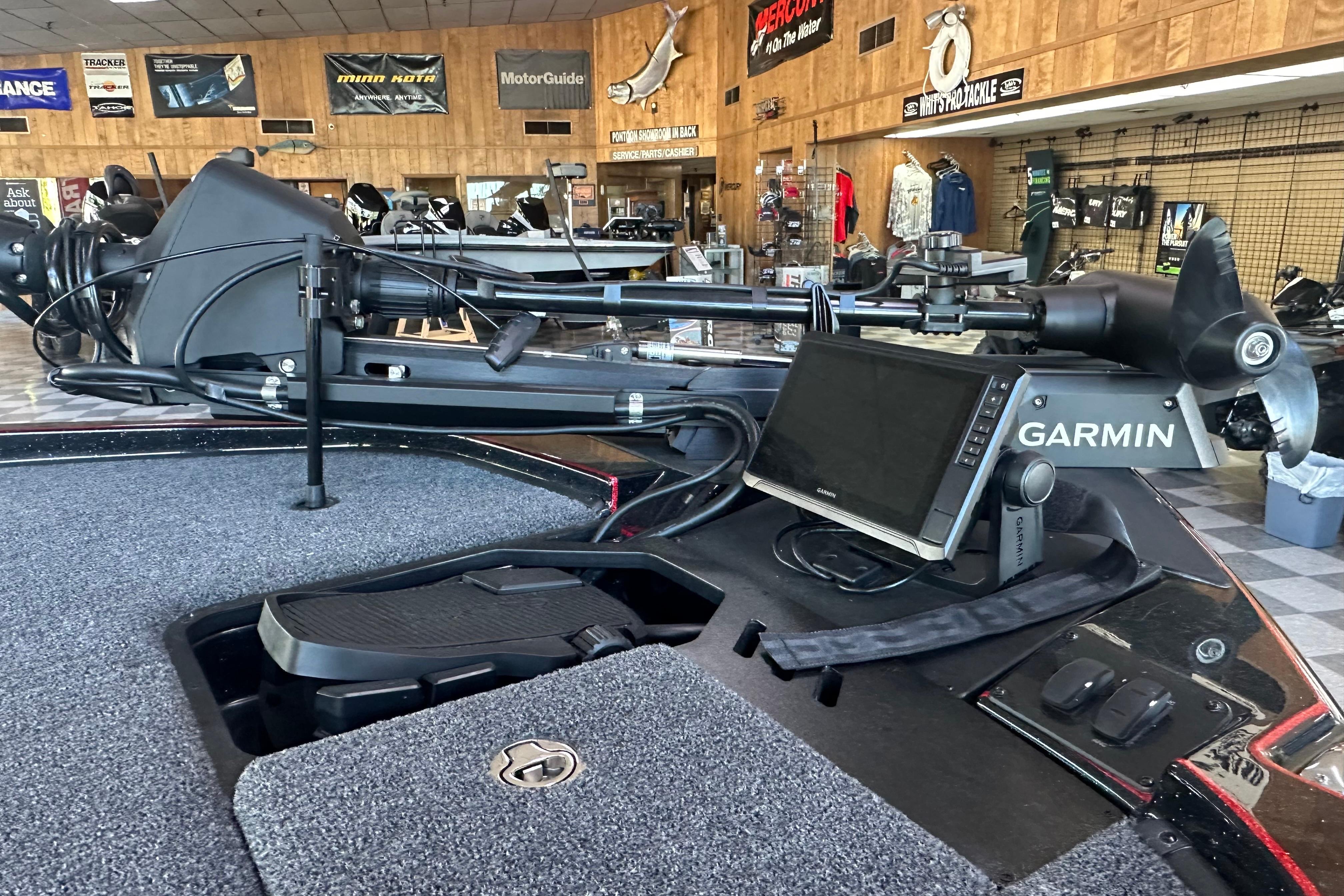2026 Triton 20XP Patriot boat with Garmin navigation system in showroom.