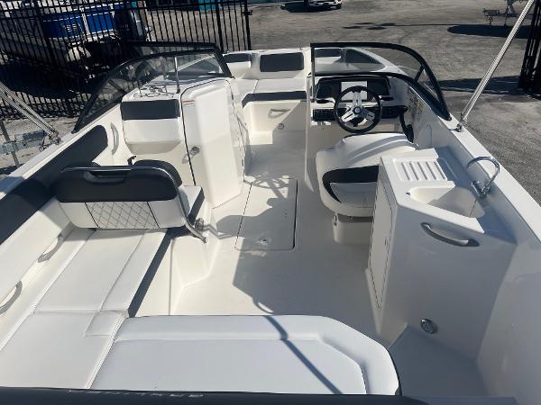 2021 Bayliner DX 2200 boat interior with seating and steering wheel.
