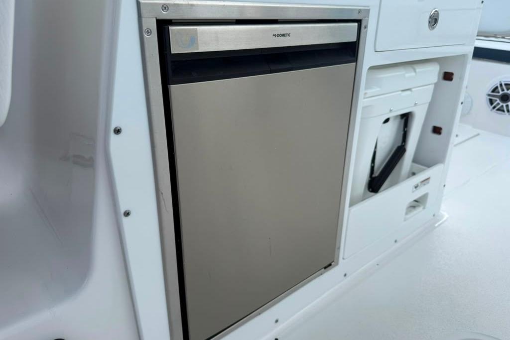 Built-in refrigerator on 2026 Sea Fox 288 Traveler boat, featuring sleek stainless steel design.