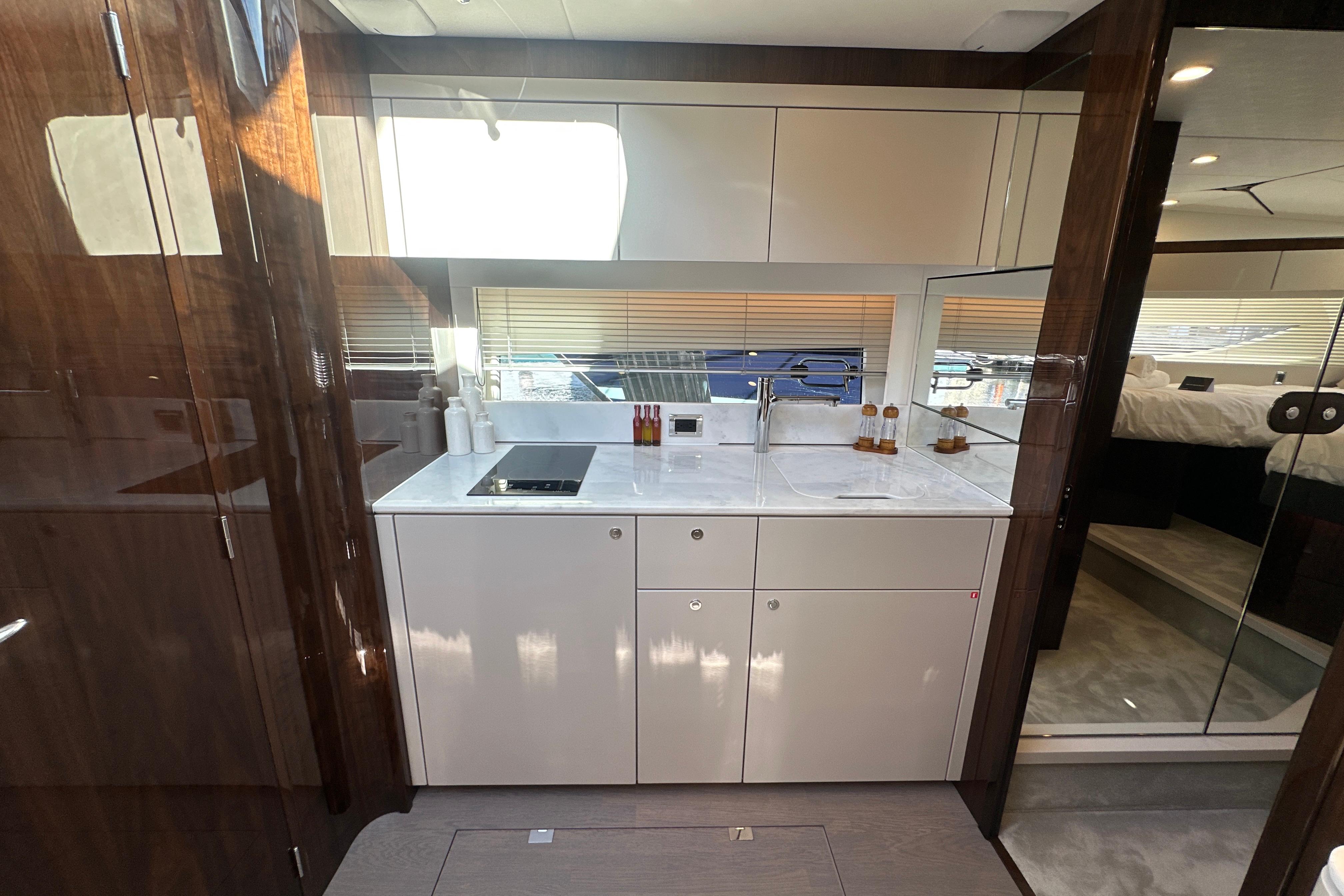 Luxurious interior of 2026 Fairline Targa 47 GT yacht with modern kitchen design.