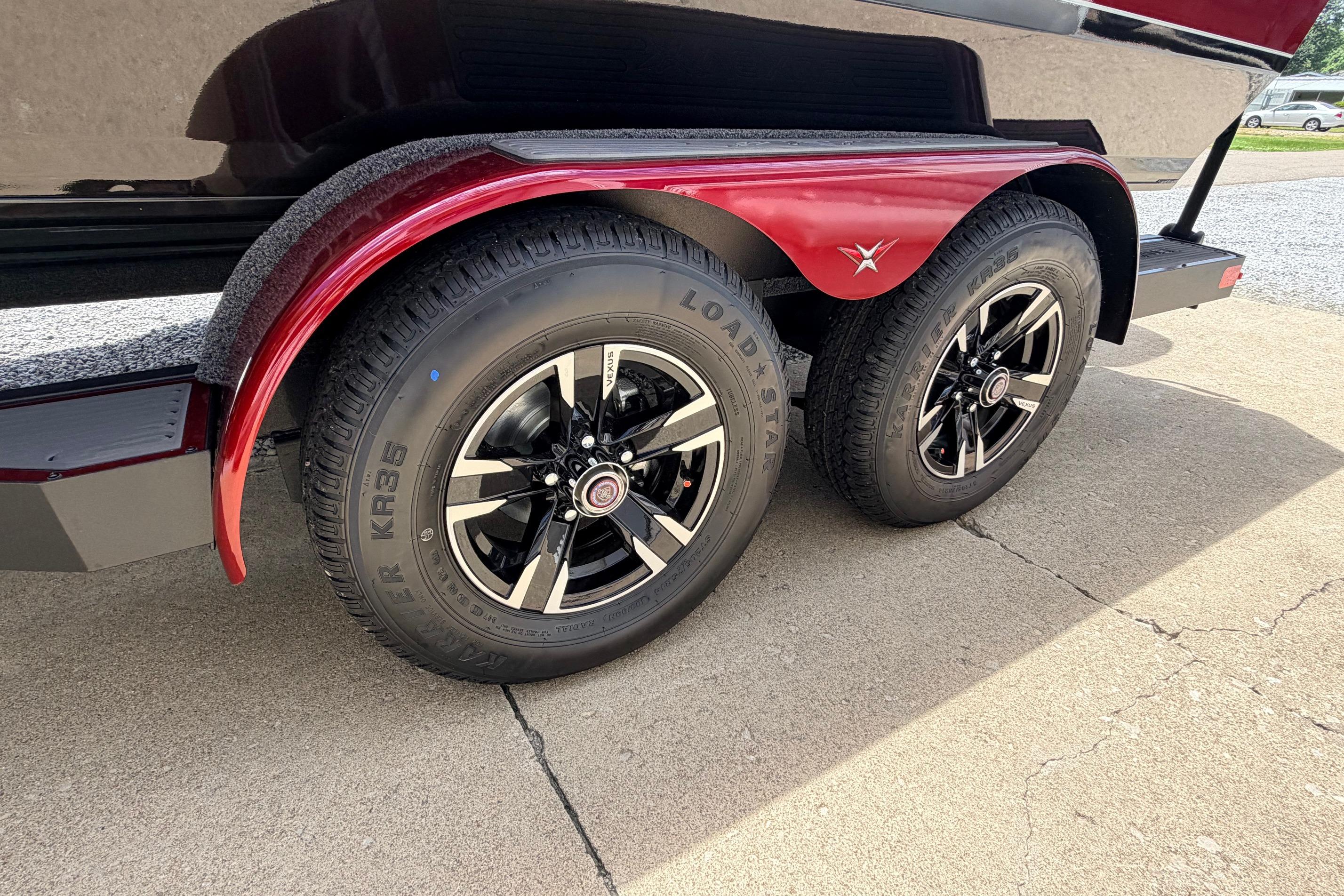 2026 Vexus AVX1985s trailer with dual black alloy wheels and red fenders.