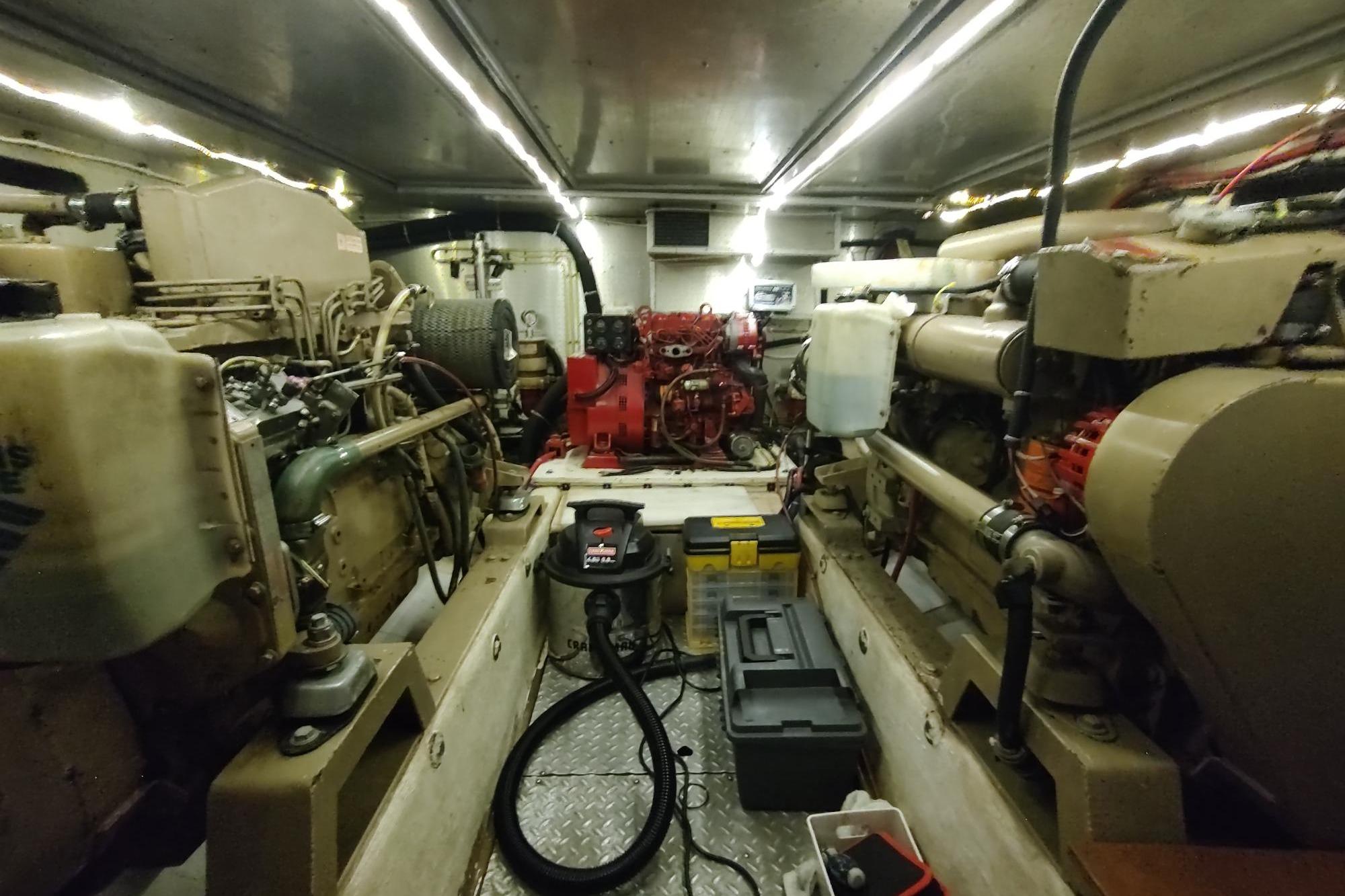 Engine room of a 1989 Hyatt Double Cabin Motoryacht, showcasing mechanical components and equipment.