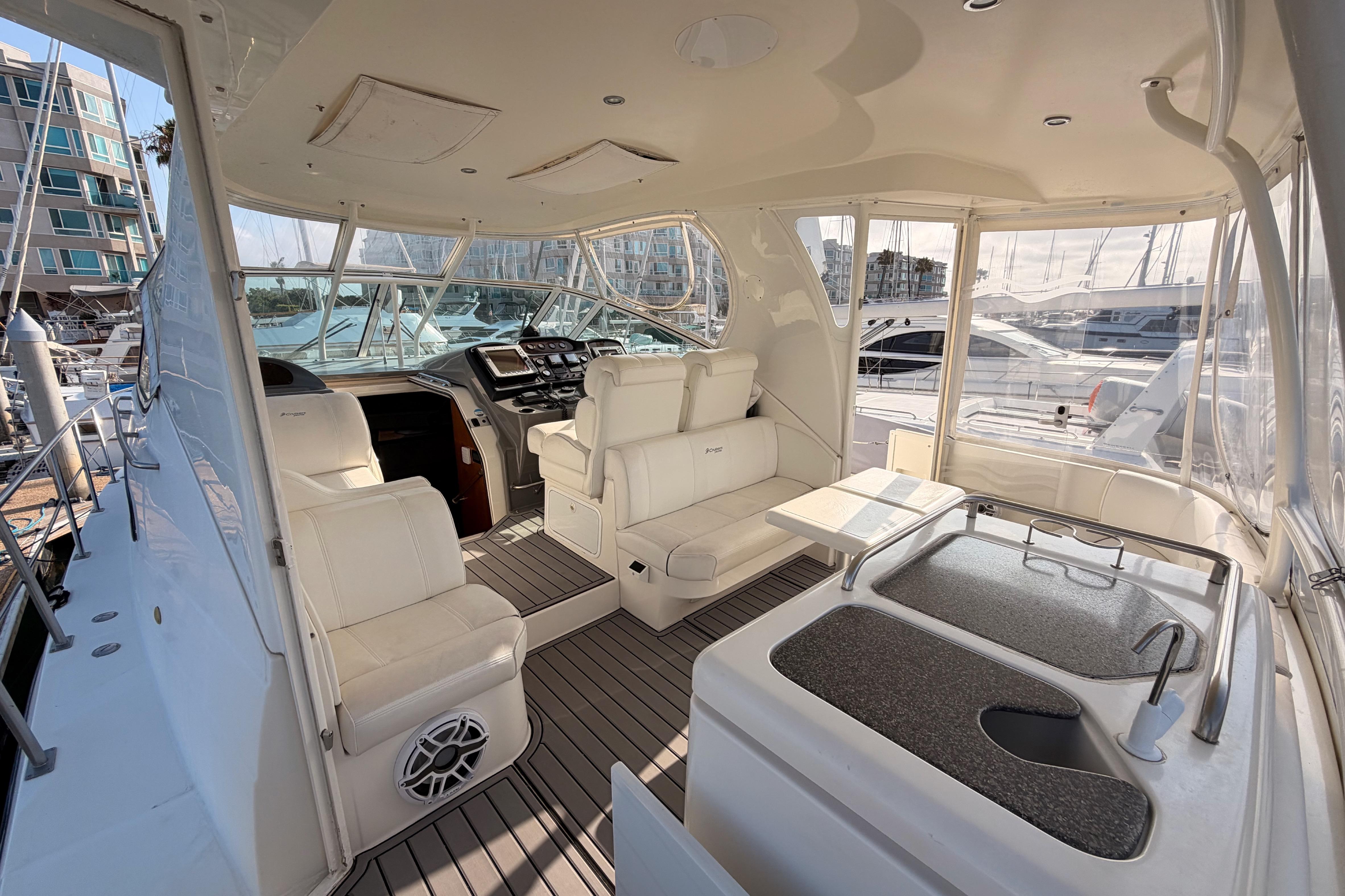 2005 Cruisers Yachts 405 Express Motoryacht interior with seating and helm station.
