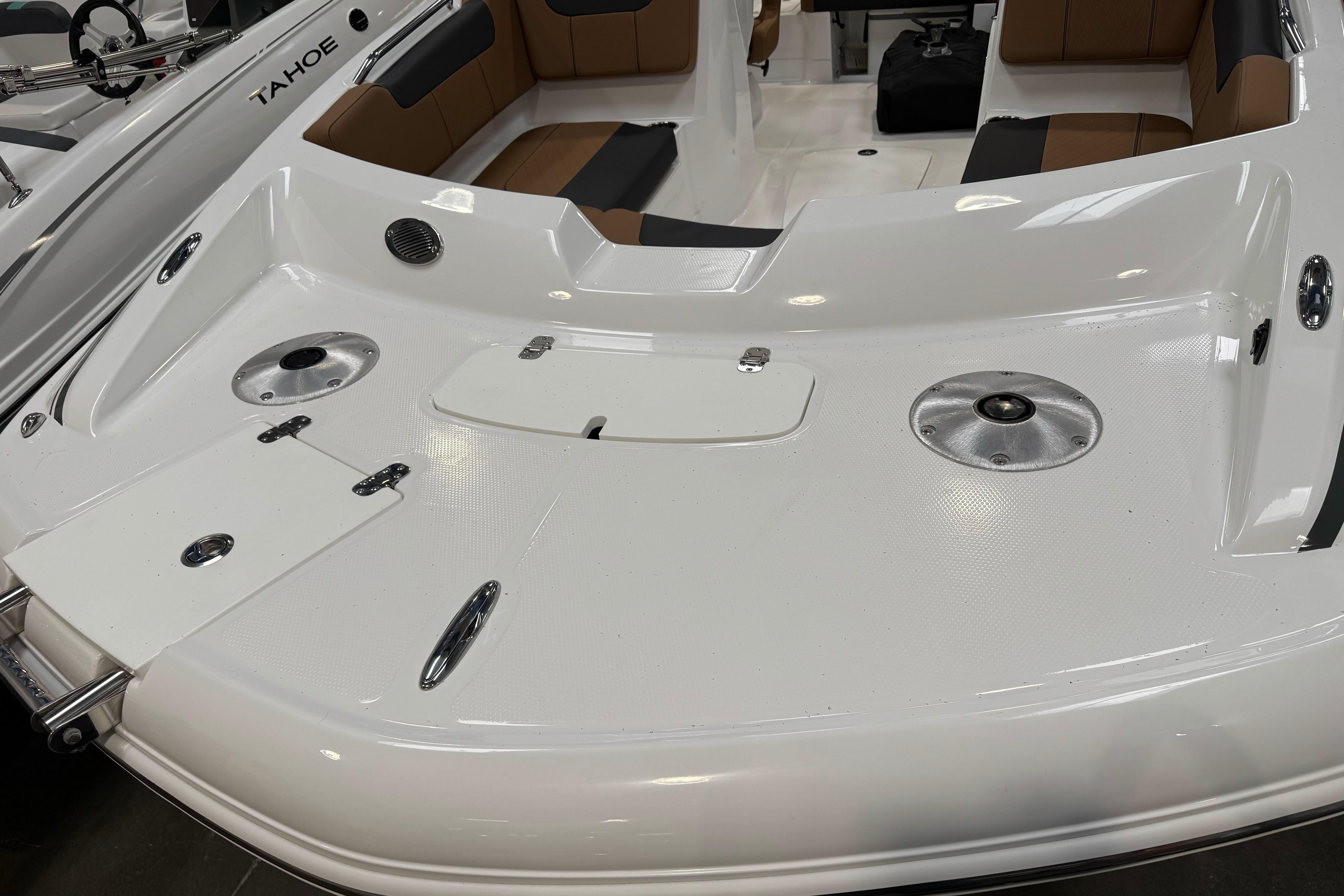 2026 Tahoe 2150 boat interior with white deck and brown seating.