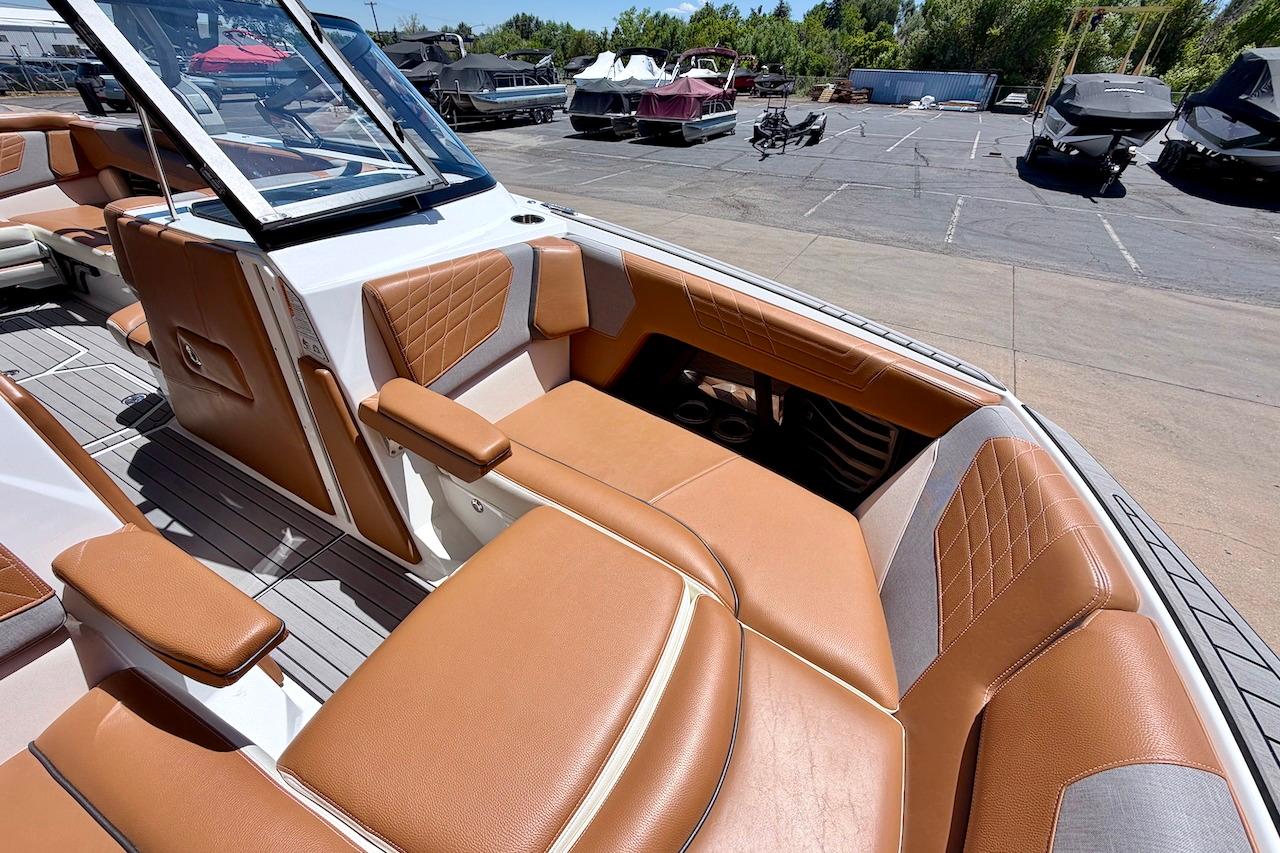 2021 Nautique Super Air Nautique G23 boat interior with tan leather seating.