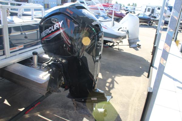 2024 Sun Tracker BB18 with Mercury outboard motor in a boatyard.