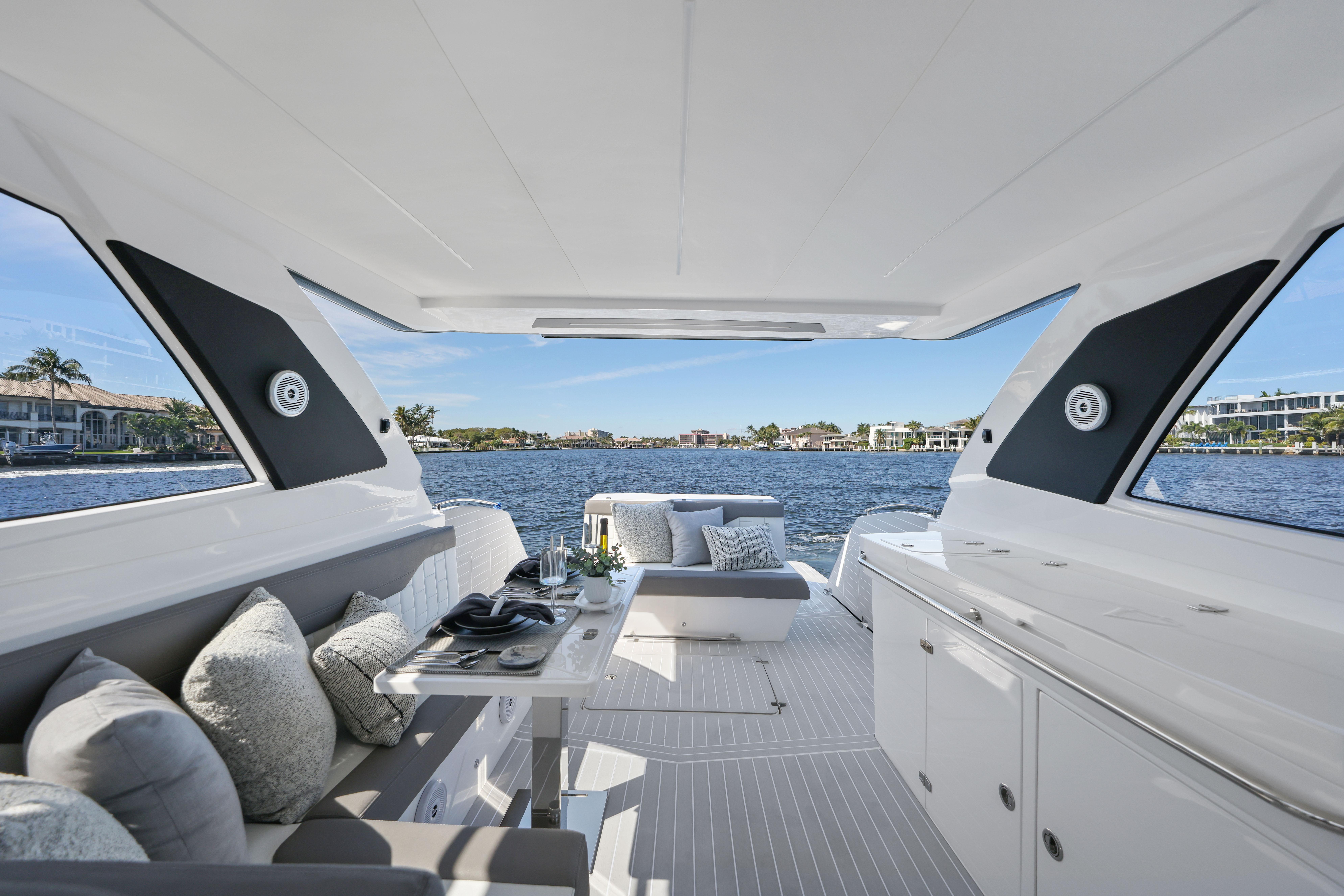 Luxurious 2025 Valiatt 380 Bowrider interior with elegant seating and scenic waterfront view.