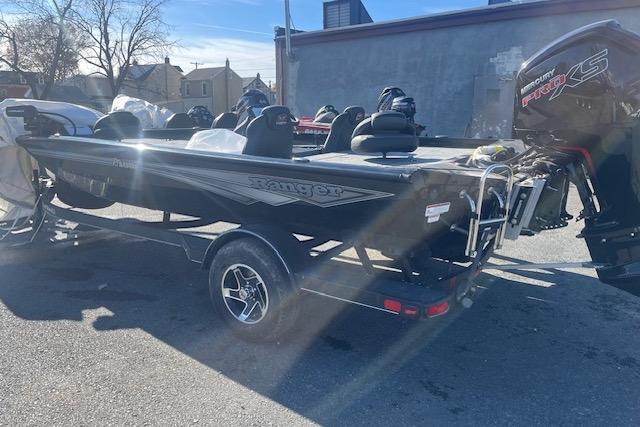 2026 Ranger RT188P boat with motor, parked outdoors on a sunny day.