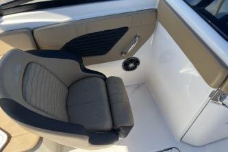 2024 Sea Ray SPX 230 boat interior with cushioned seating and sleek design.