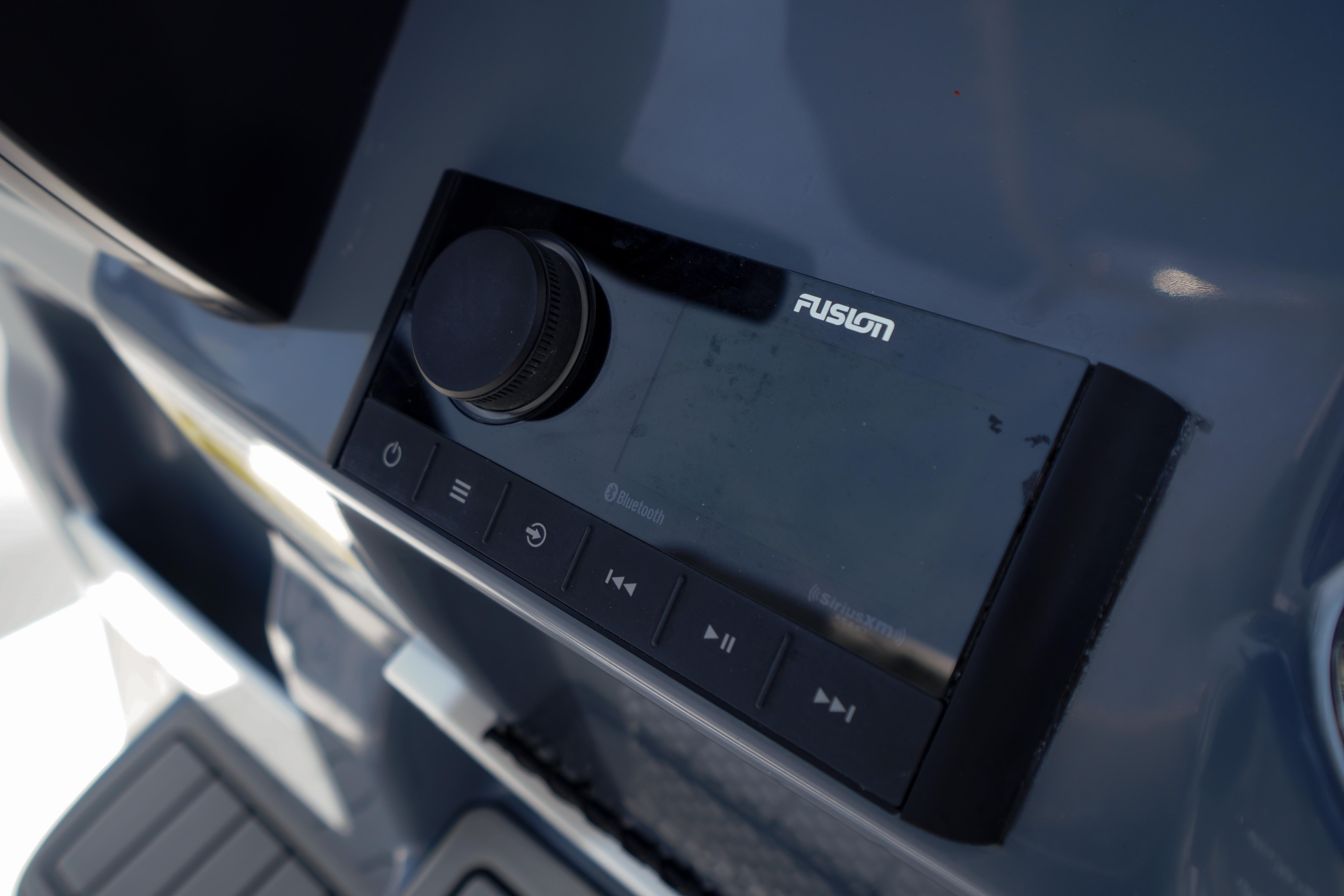 Fusion audio system on 2027 Tidewater 220 CC Adventure boat dashboard.