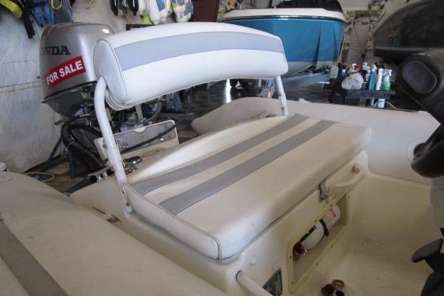 2000 Zodiac Yachtline 340DL boat seat with Honda motor, for sale sign visible.