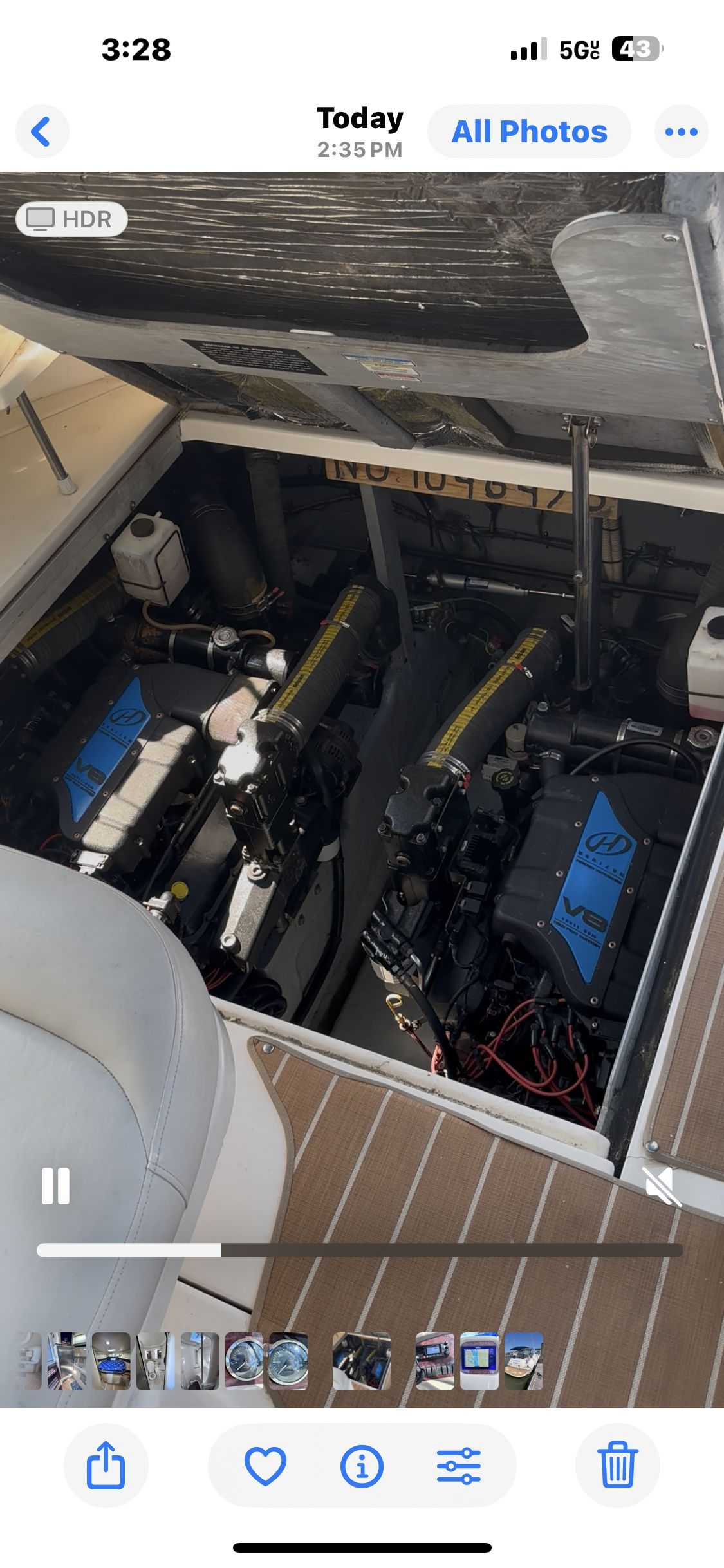 Engine compartment of a 2000 Sea Ray 380 Sundancer boat, showcasing dual engines.