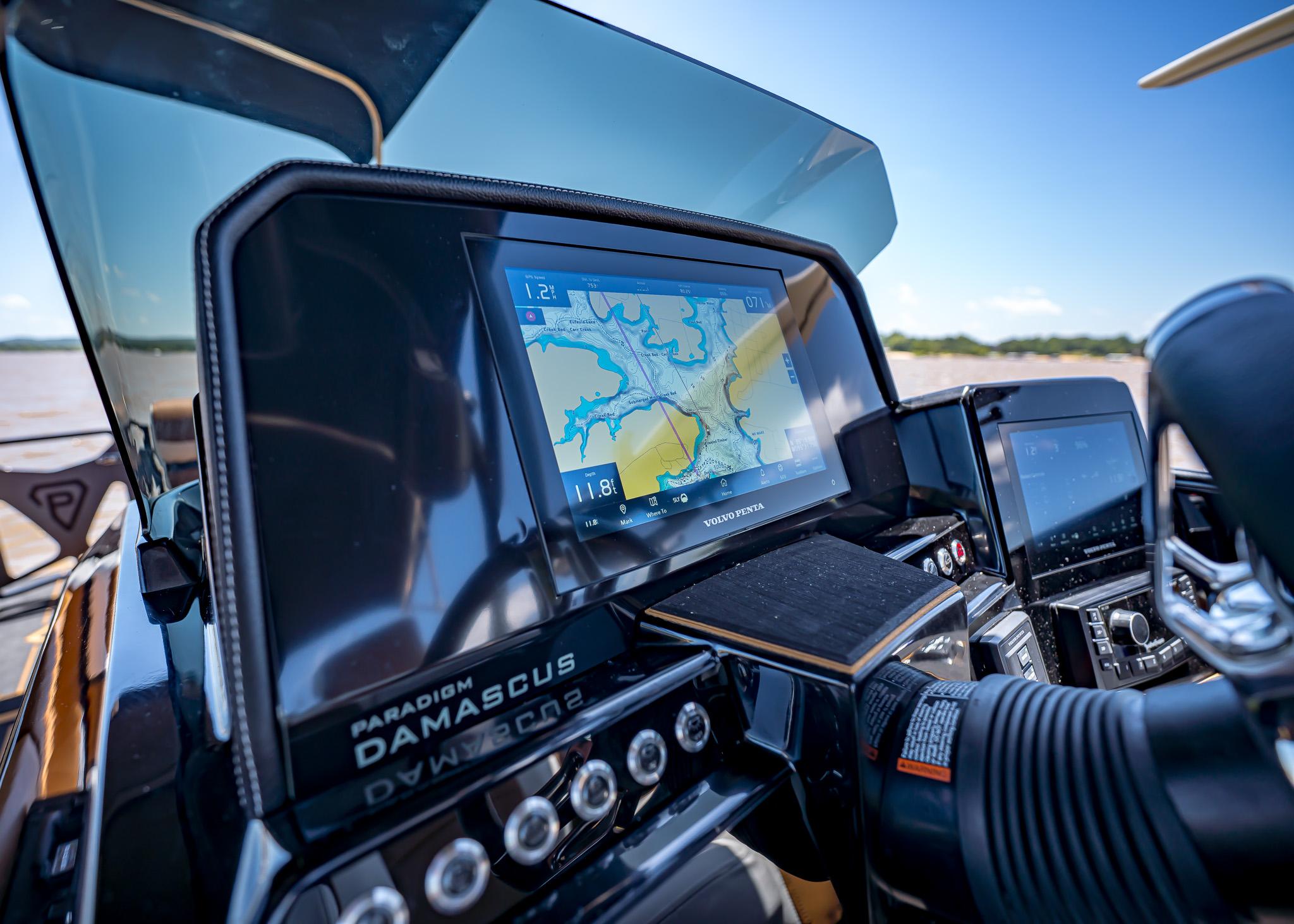 High-tech dashboard of 2025 Paradigm 236 boat with navigation display.