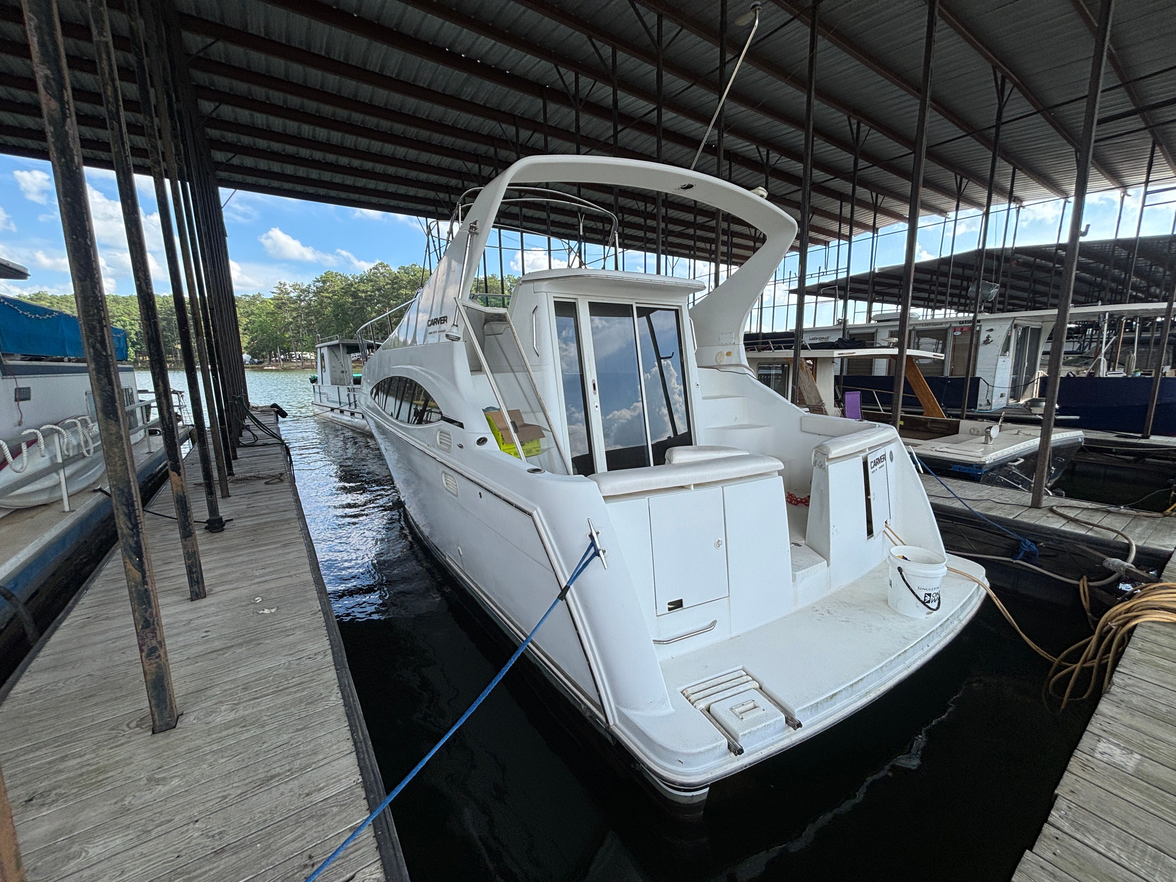 2001 Carver 350 Mariner docked in a covered marina.