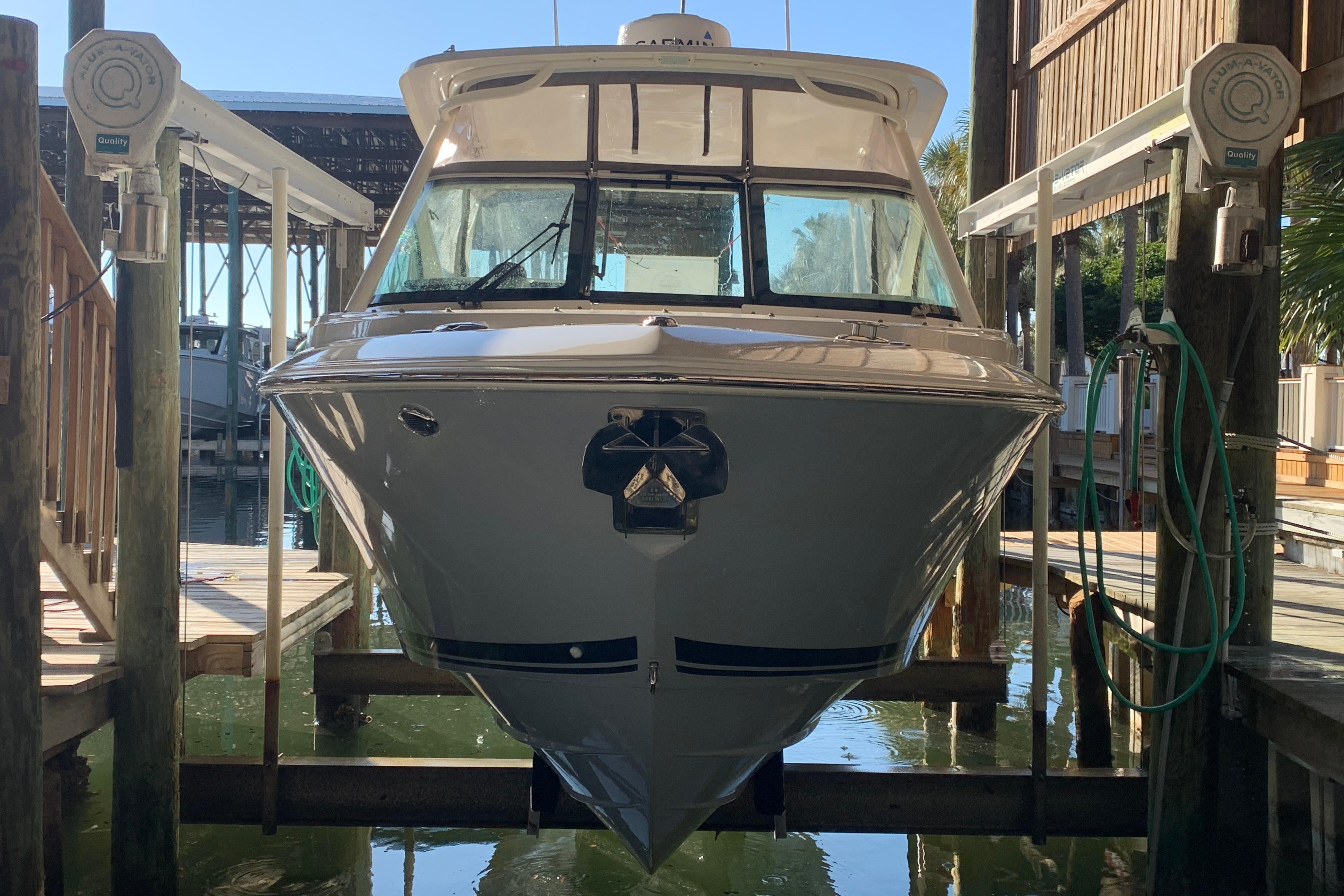 2023 Pursuit DC 266 Dual Console boat docked in marina.