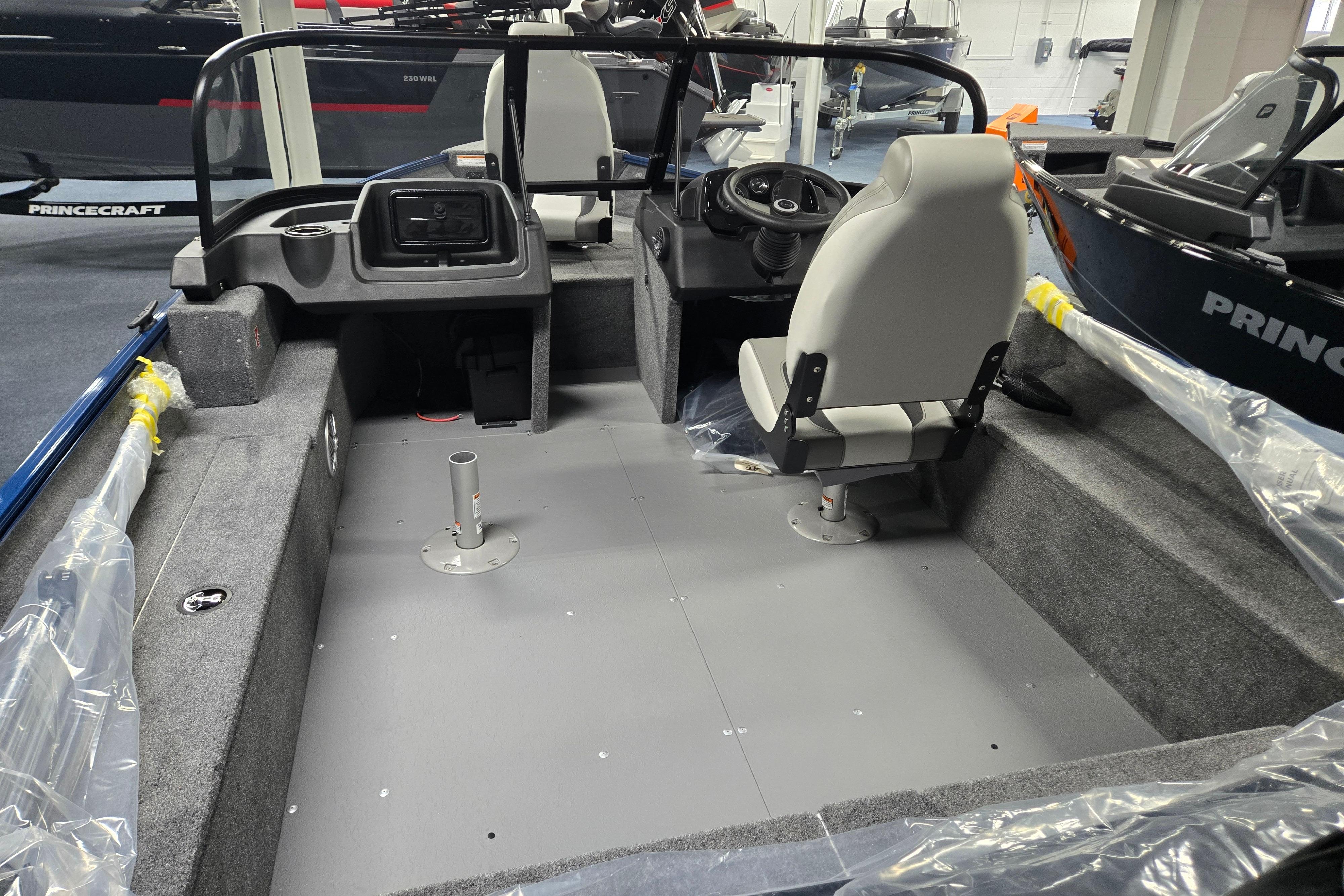 2026 Princecraft Holiday 162 WS MAX boat interior, featuring steering console and seating.