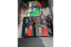 Battery setup in a 2023 Nitro ZV19 Sport boat, featuring multiple connected batteries.