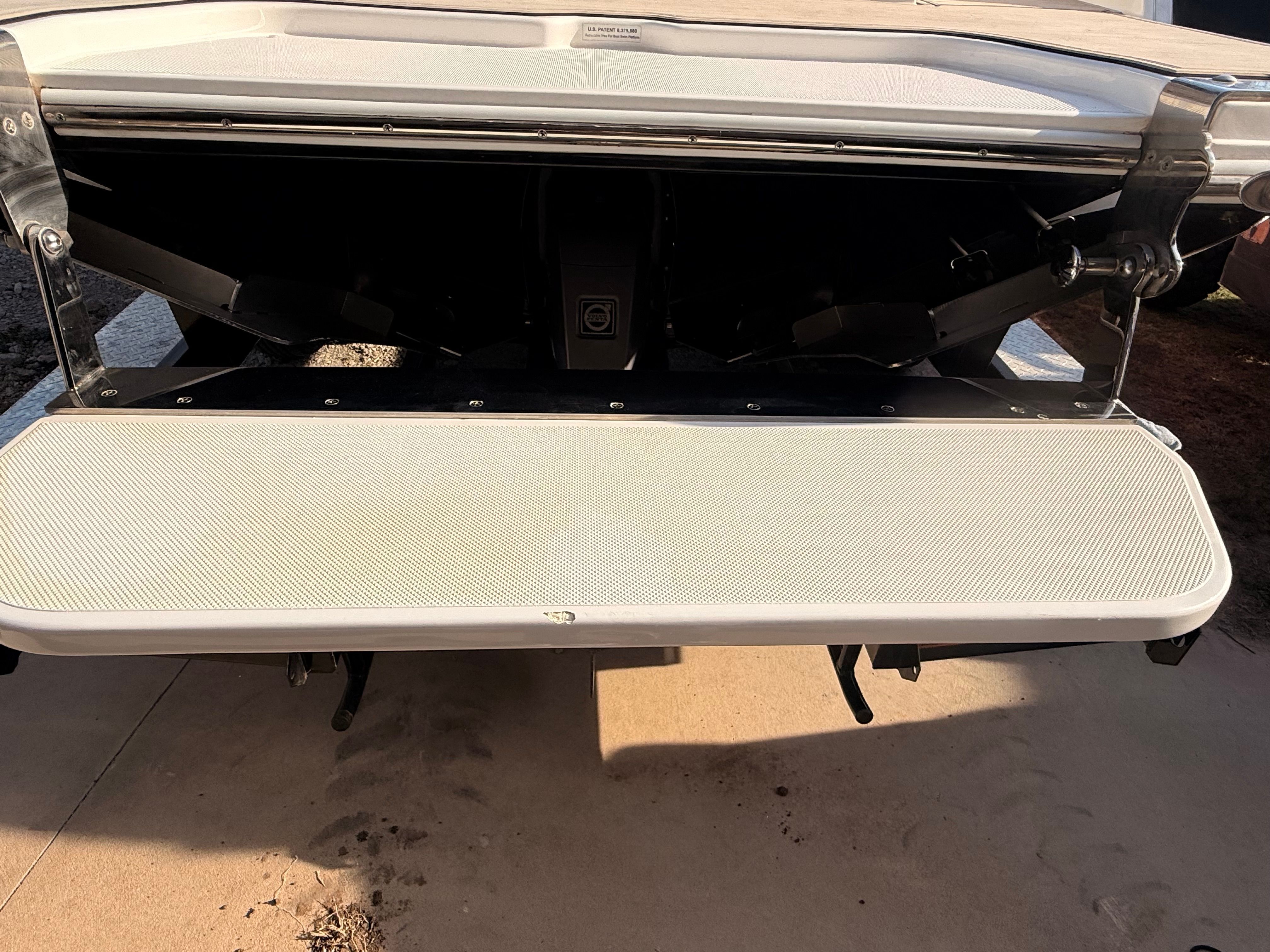 The image shows the stern of a 2019 Cobalt R7 Surf boat with a wide swim platform.
